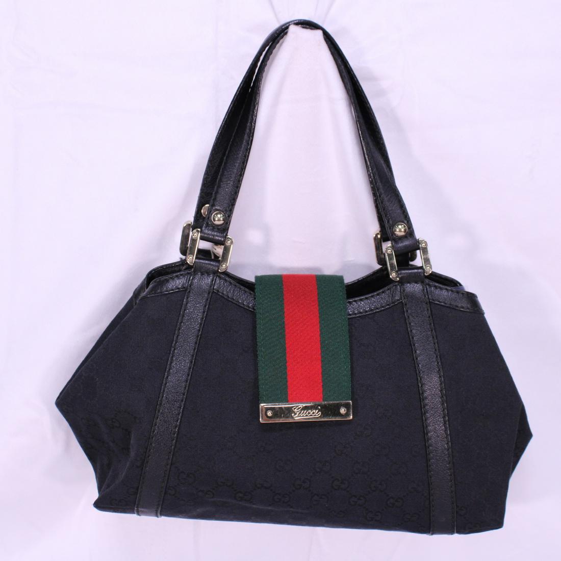 Gucci Web Handbag in Monogrammed Canvas: Genuine Pre-Owned Gucci Web Handbag in Black Monogrammed Canvas in A condition. Date Code is 233610/200047. This lot includes a certificate of authenticity.