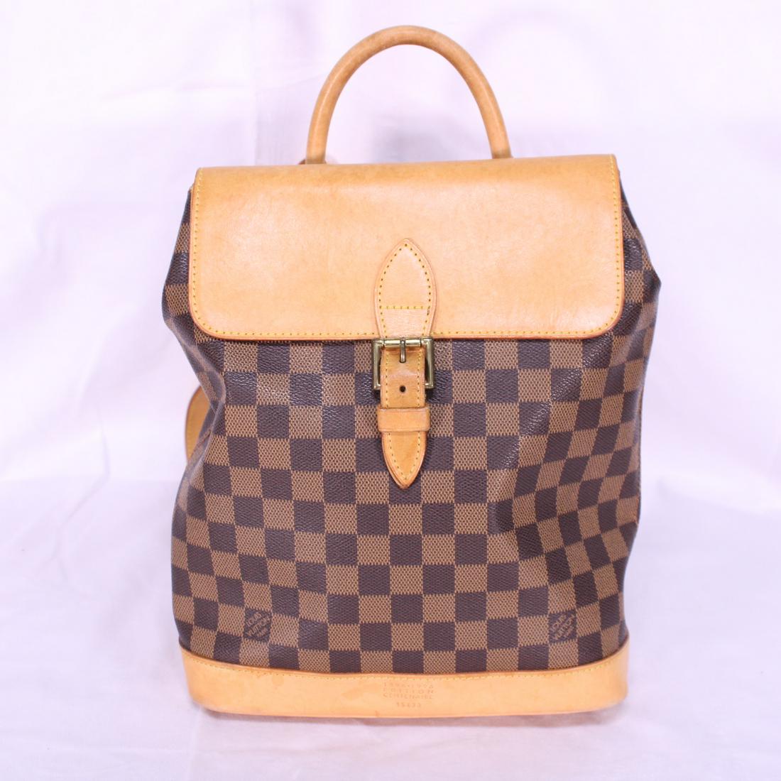 Louis Vuitton Soho Centenaire in Damier Ebene: Genuine Pre-Owned Louis Vuitton Soho Centenaire in Brown Damier Ebene in A condition. Date Code is TH0937. Includes Dustbag. Measurements: 25*31*10cm (Length * Height * Width). This lot includes a cer