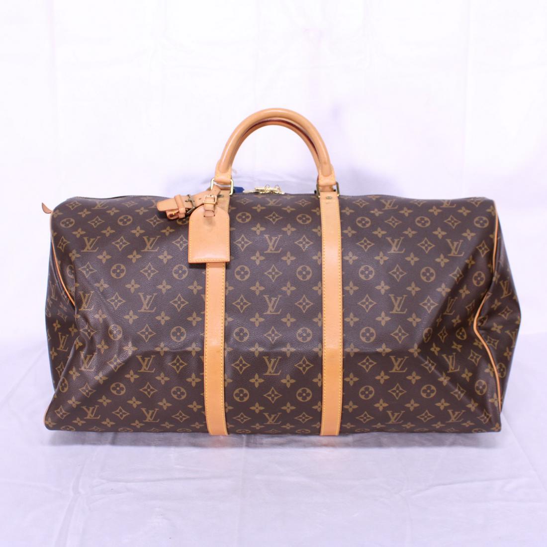 Louis Vuitton Keepall 60 in Monogram Canvas: Genuine Pre-Owned Louis Vuitton Keepall 60 in Brown Monogram Canvas in A condition. Date Code is MI0922. Includes Luggage Tag, Handle Strap. Measurements: 60*26*31cm (Length * Height * Width). This lo