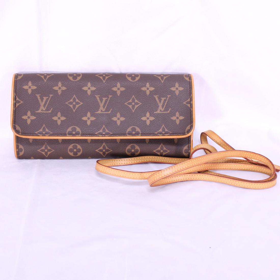 Louis Vuitton Twin GM in Monogram Canvas: Genuine Pre-Owned Louis Vuitton Twin GM in Brown Monogram Canvas in A condition. Date Code is SD0080. This lot includes a certificate of authenticity.