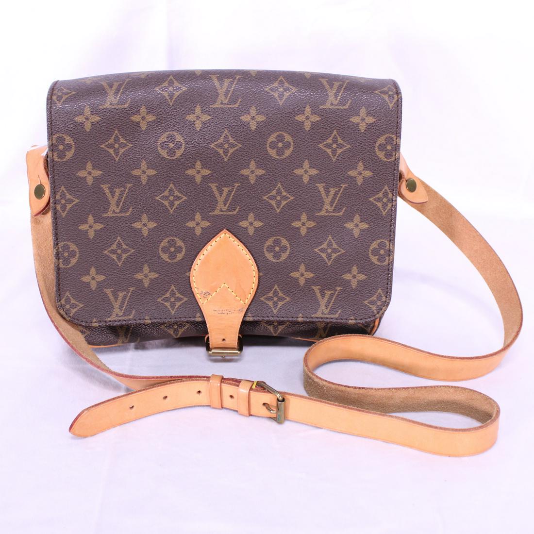 Louis Vuitton Cartouchiere GM in Monogram Canvas: Genuine Pre-Owned Louis Vuitton Cartouchiere GM in Brown Monogram Canvas in A condition. Date Code is SL0911. Measurements: 25*21*7cm (Length * Height * Width). This lot includes a certificate of auth