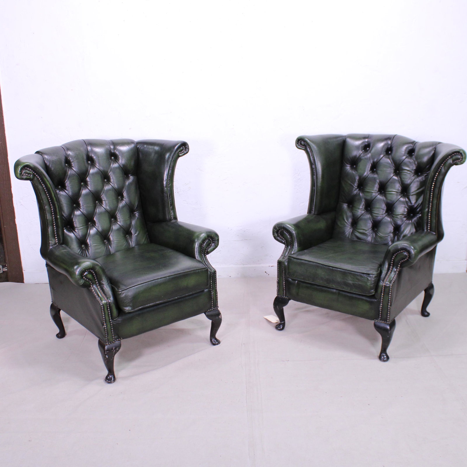 Pair Green Leather Chesterfield Tufted Wing Chairs: Pair Green Leather Chesterfield Tufted Wing Chairs - George III Style wingchairs / armchairs - 40x38x34
