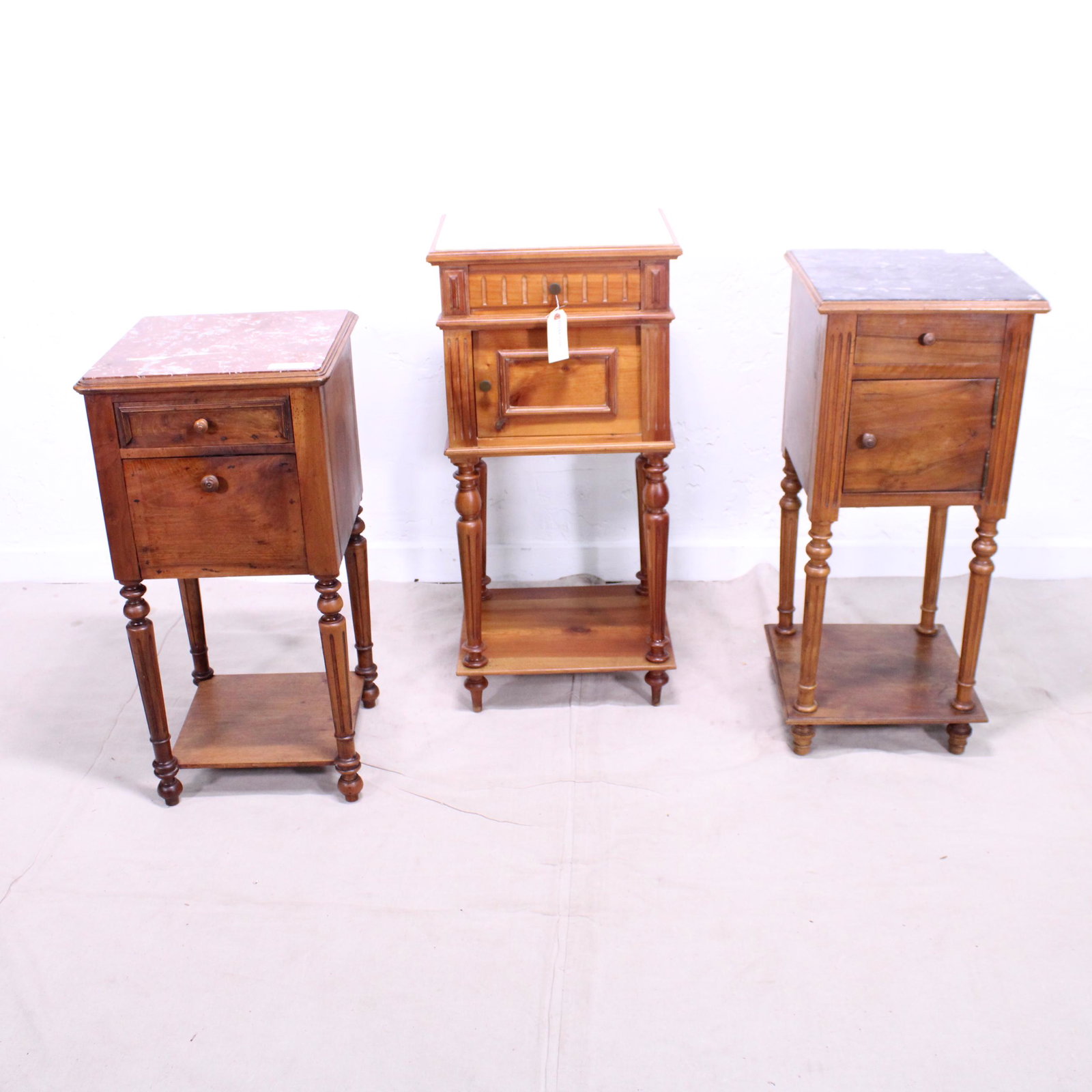 Trio of Three French Marble Topped Night Stands: Trio of Three French Marble Topped Night Stands - largest is 35 in tall x 17 x 15