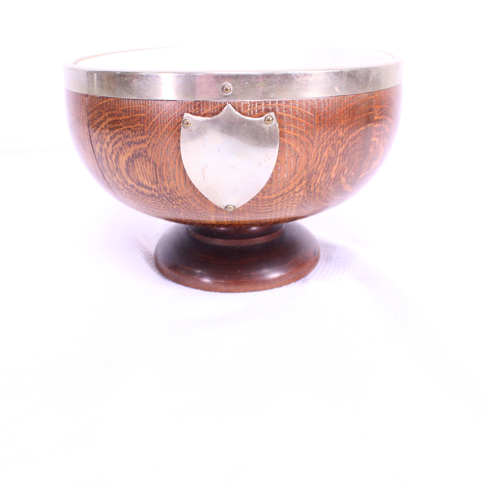 English Oak Trophy Bowl with Liner: This British Trophy Bowl is made from oak, features a porcelain liner and unengraved shield shaped plaque.- 7 in x 9 x 9