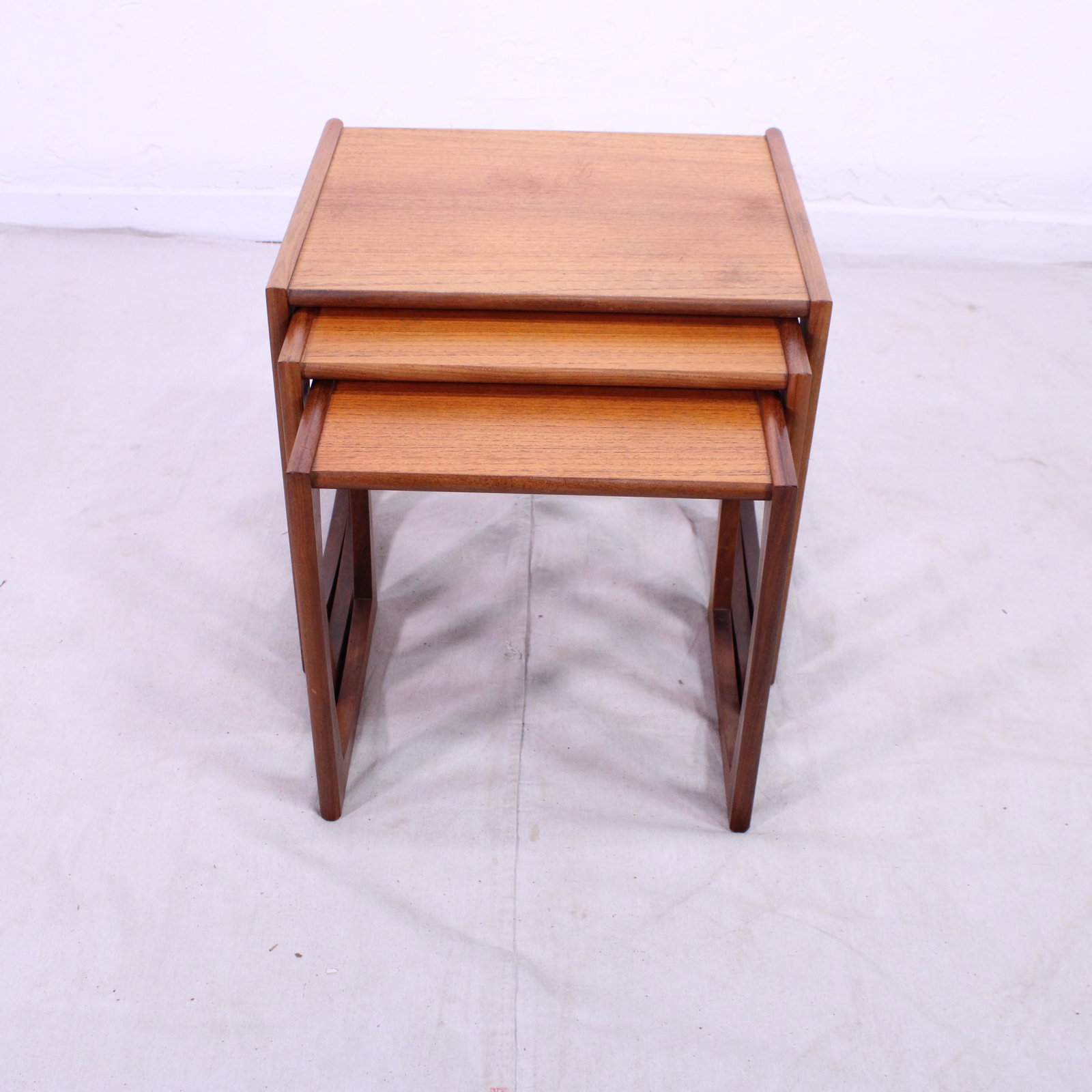 Mid Century Modern Quadrille Nest By G-plan #1: This Danish Modern Style Nest is British and made by Mid Century Modern Furniture Maker G Plan ( Gplan ) it stacks to make a bookcase as well. Measurement for largest table is 20in tall x 22 wide x 18