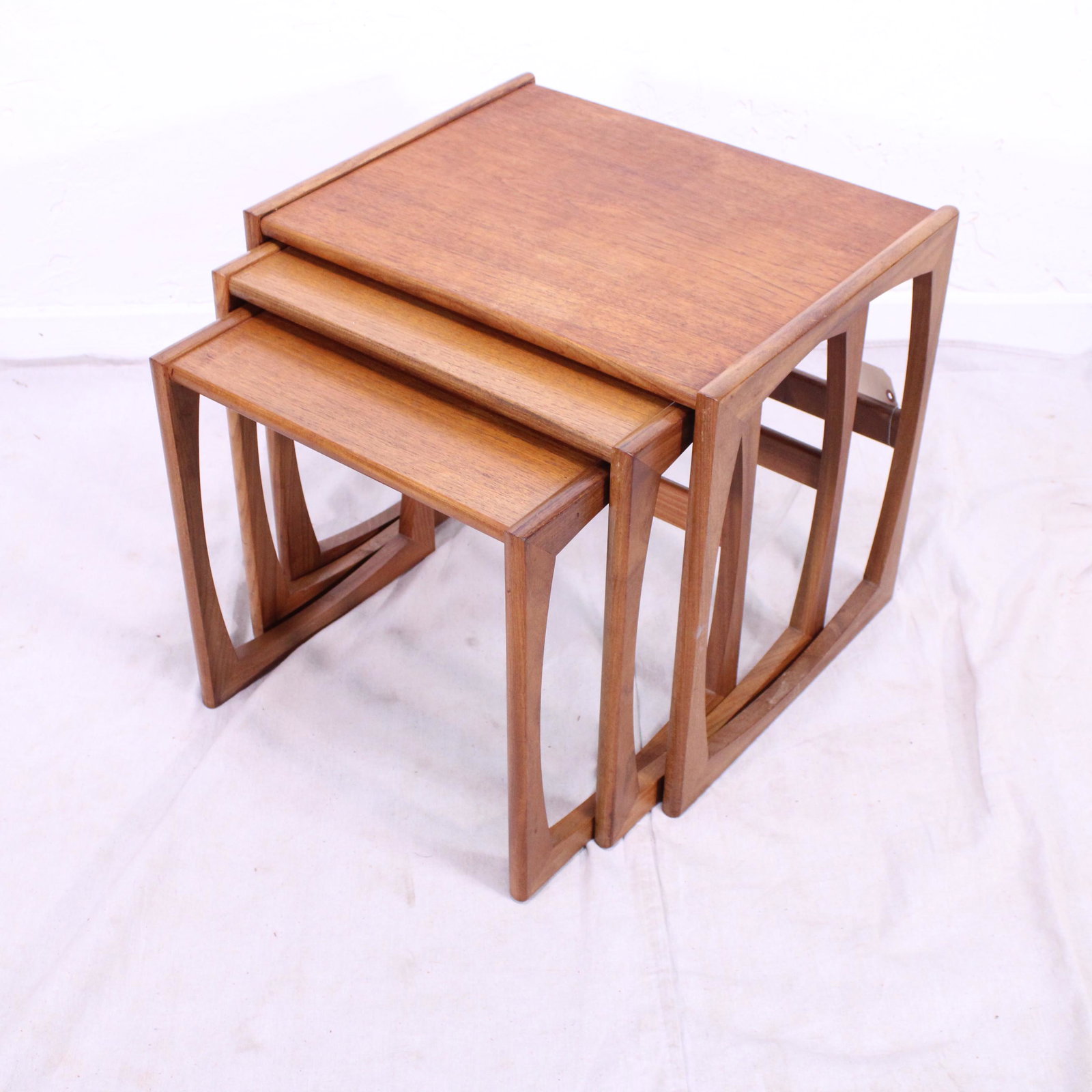 Mid Century Modern Quadrille Nest By G-plan: This Danish Modern Style Nest is British and made by Mid Century Modern Furniture Maker G Plan ( Gplan ) it stacks to make a bookcase as well. Measurement for largest table is 20in tall x 22 wide x 18