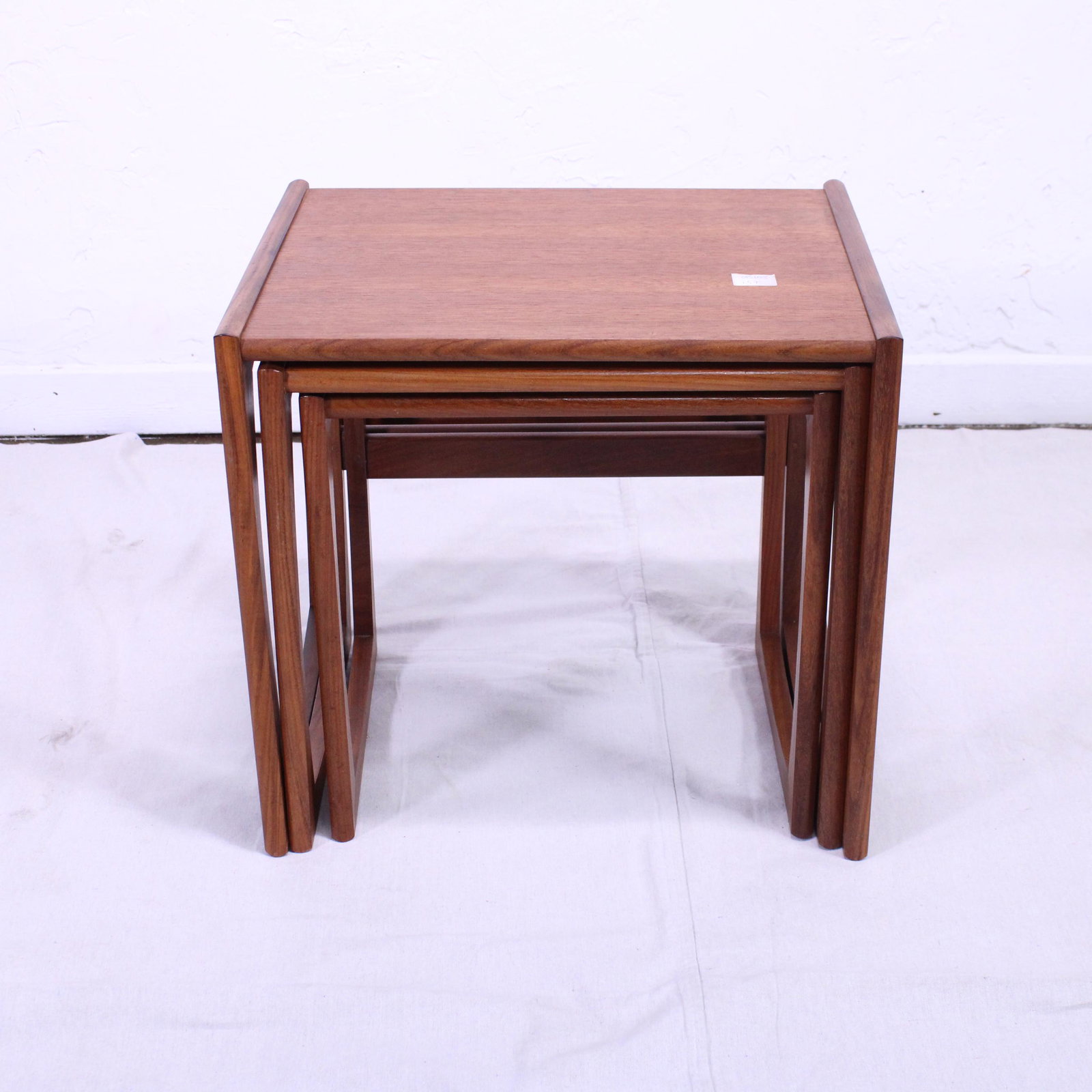 Mid Century Modern Quadrille Nest By G-plan: This Danish Modern Style Nest is British and made by Mid Century Modern Furniture Maker G Plan ( Gplan ) it stacks to make a bookcase as well. Measurement for largest table is 20in tall x 22 wide x 18