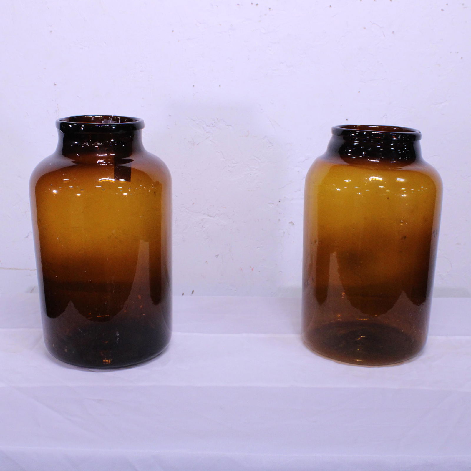 Two Modern Amber Glass Jars: Two Modern Amber Glass Jars - 17 in tall x 11 round - Retail Price $270