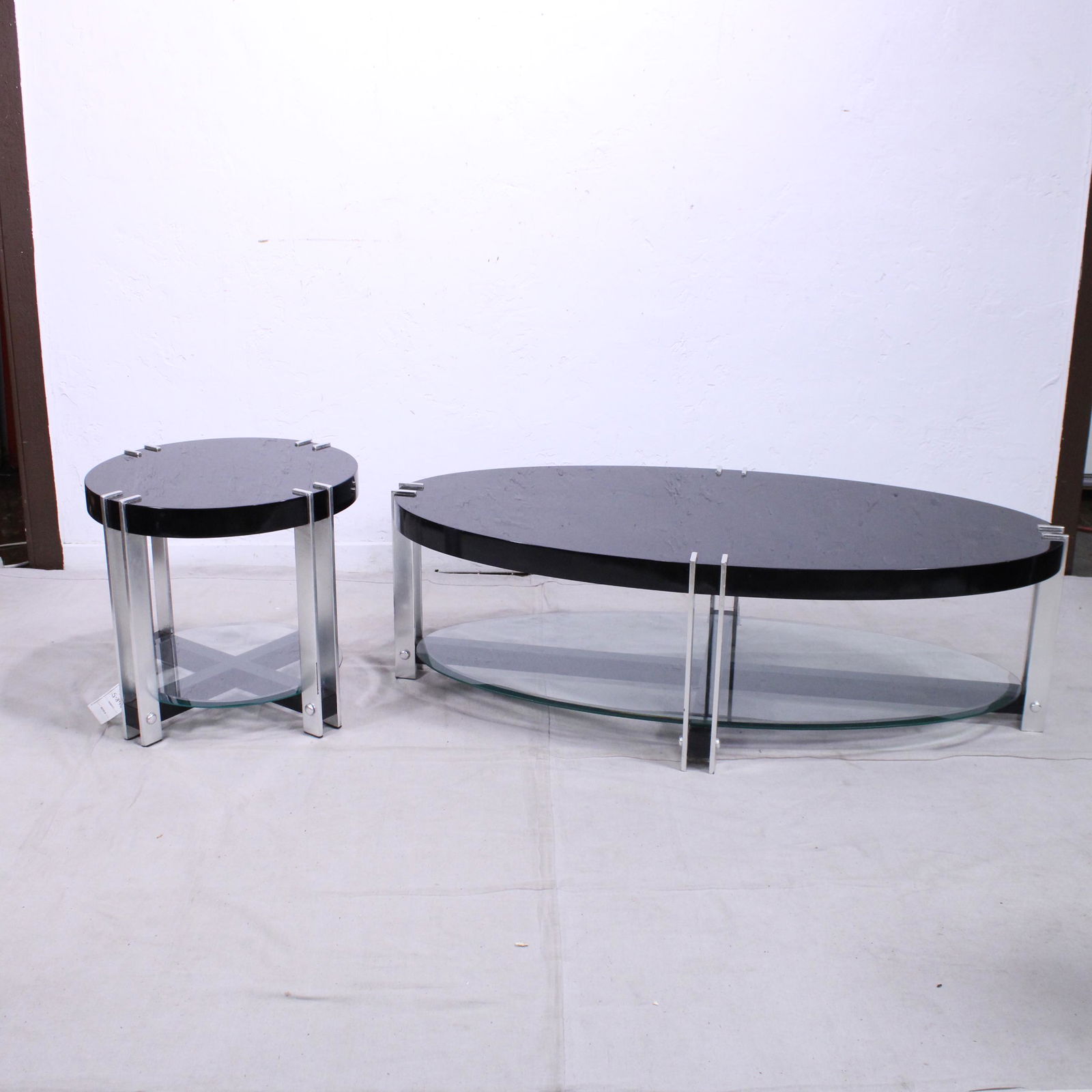 Modern Oval Coffee Table & Round Lamp Table: Modern Oval Coffee Table & Round Lamp Table - Black tops, glass shelves & Metal Legs - Coffee Table is 19 in tall x 30 x 60 - Lamp Table 22 in tall x 24 in round