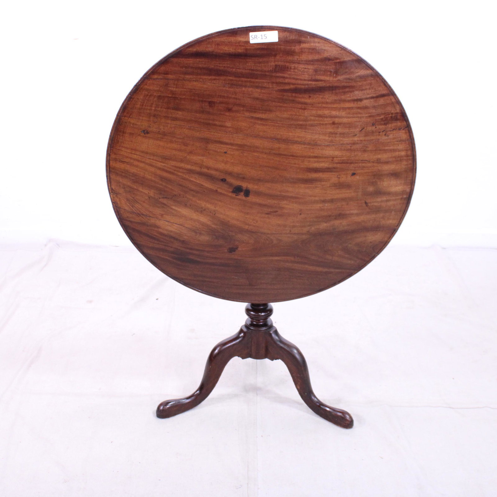 Chippendale Striped Mahogany Tilt Top Tea Table: Chippendale Striped Mahogany Tilt Top Tea Table wit bird cage & brass clip support. Column and slender tapering cabriole legs suggest a manufacture location of Philadelphia, PA Circa 1800's - 47 in ta
