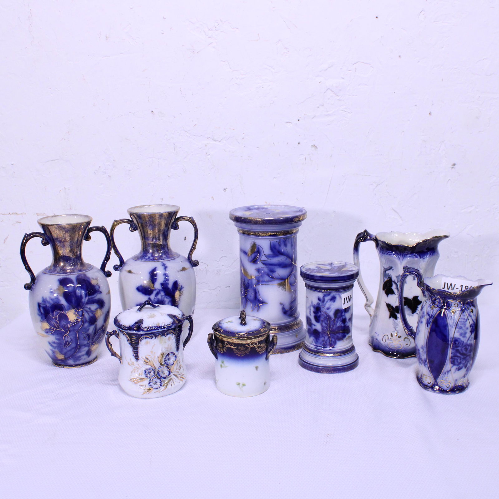 Collection of 8 Blue & White Pitchers, Vases & Jars: Collection of 8 Flow Blue, Gold & White Pitchers, Vases & Jars - Tallest is 11 in tall - Marks : T. Forester & Sons Imperial Blue , Austria