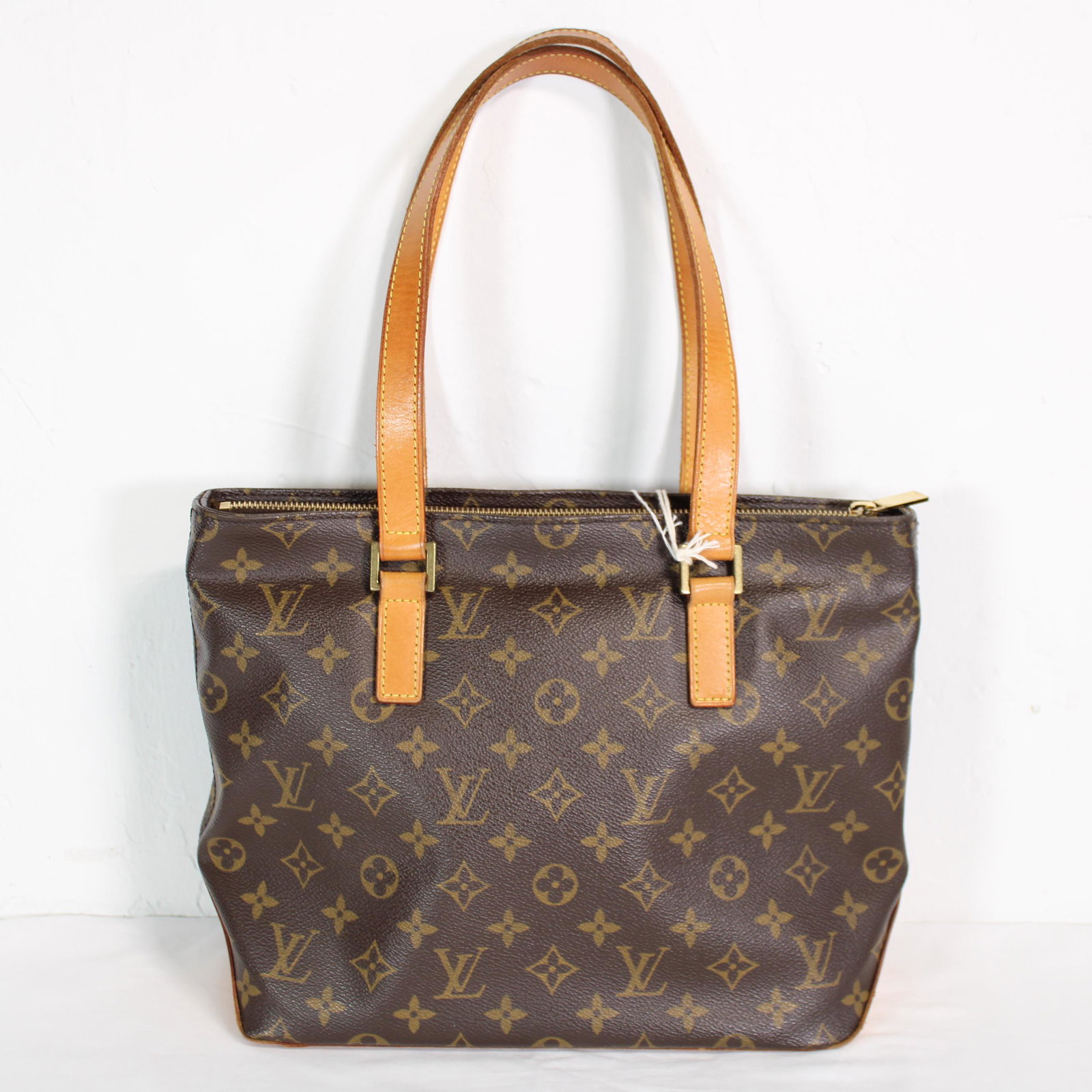 Louis Vuitton Cabas Piano in Monogram Canvas: Genuine Pre-Owned Louis Vuitton Cabas Piano in Brown Monogram Canvas in A condition. Date Code is SD1012. Measurements: 27*24*12cm (Length * Height * Width). This lot includes a certificate of authent