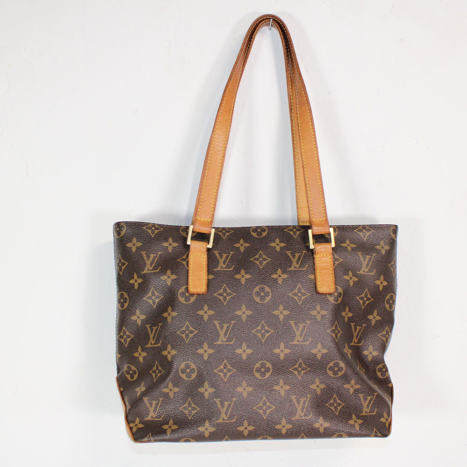 Louis Vuitton Cabas Piano in Monogram Canvas: Genuine Pre-Owned Louis Vuitton Cabas Piano in Brown Monogram Canvas in AB condition. Date Code is VI0014. Measurements: 27*24*12cm (Length * Height * Width). This lot includes a certificate of authen