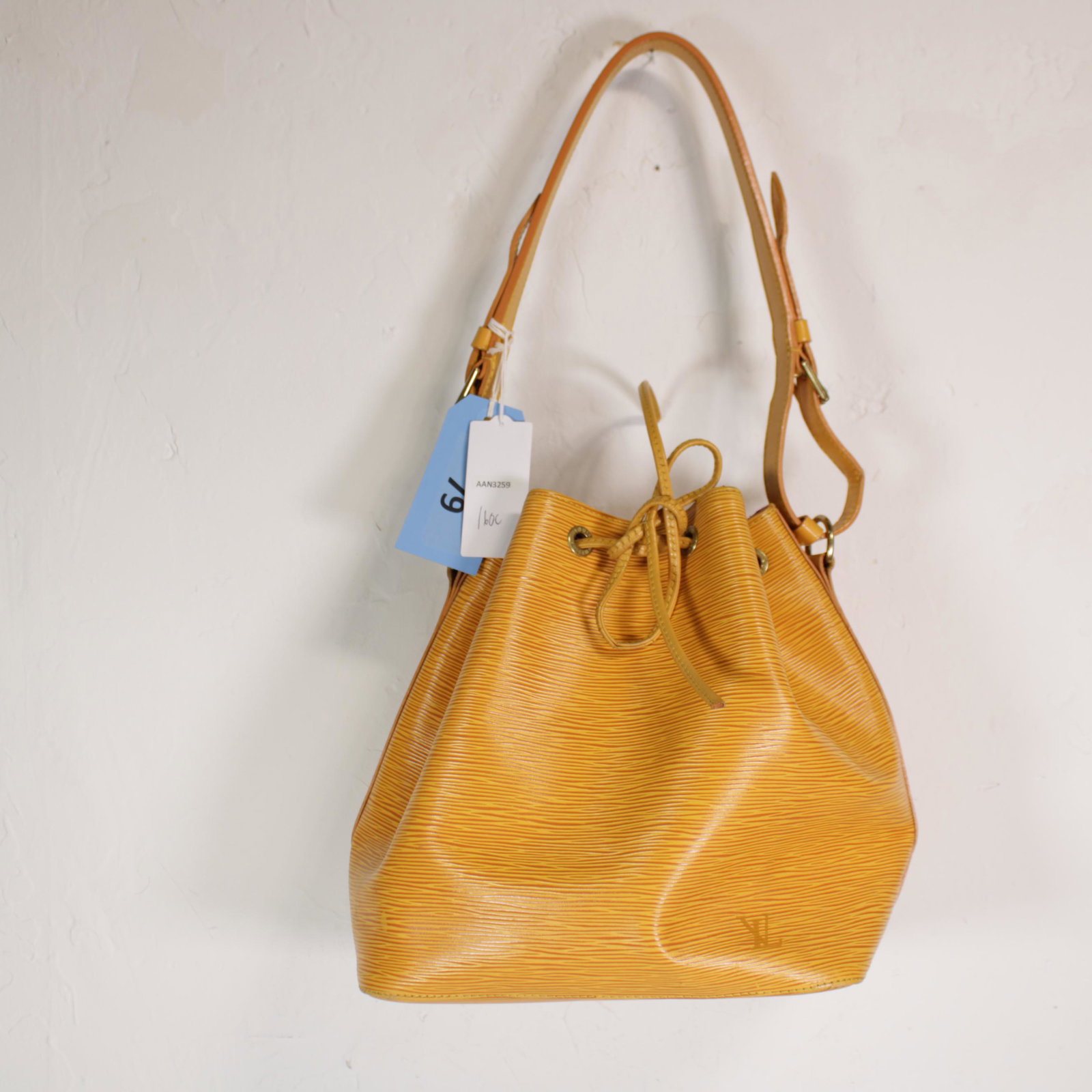 Louis Vuitton Noe PM in Yellow Leather Epi: Genuine Pre-Owned Louis Vuitton Noe PM in Yellow Epi in A condition. Date Code is AR0916. Measurements: 24*26*18cm (Length * Height * Width). This lot includes a certificate of authenticity.