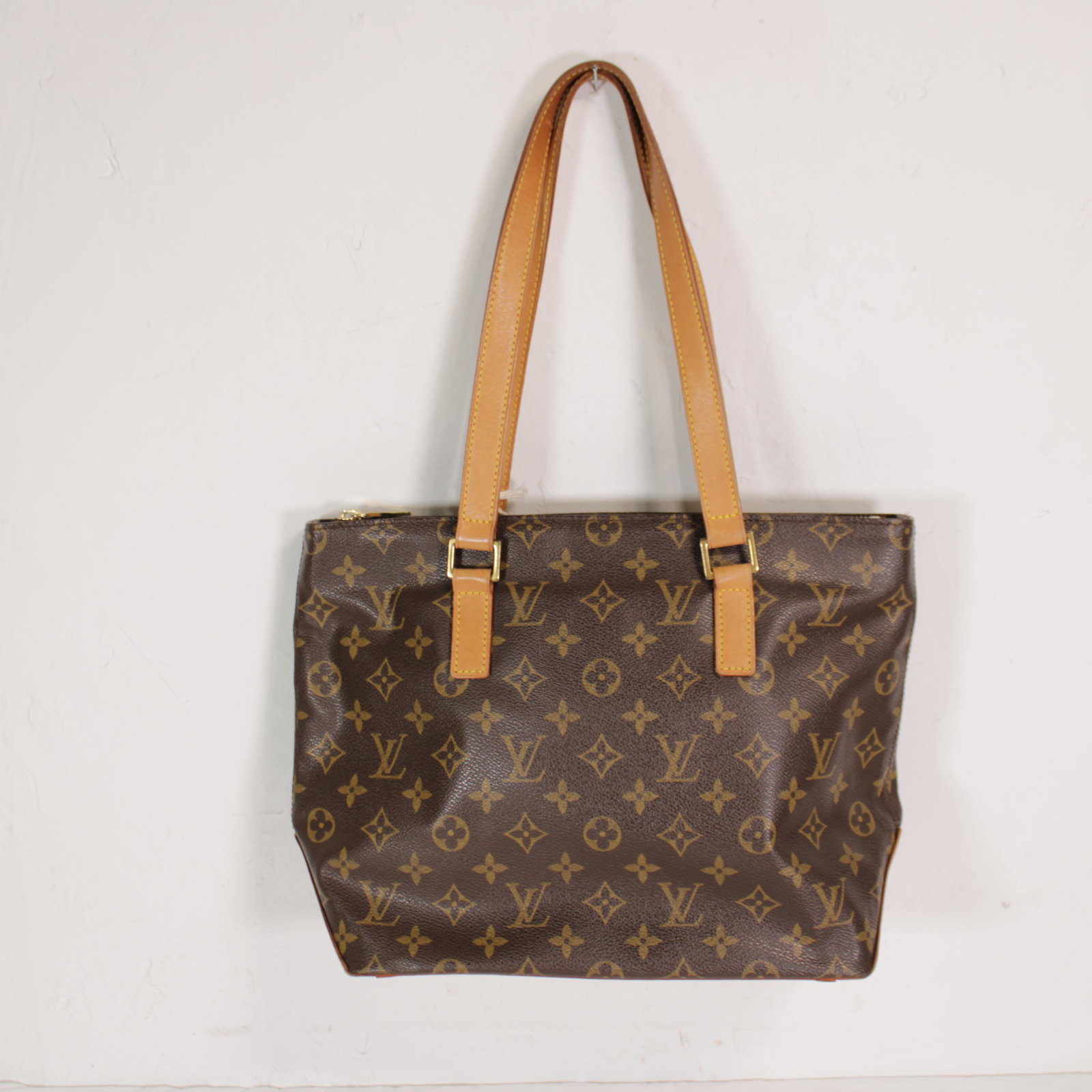 Louis Vuitton Cabas Piano in Monogram Canvas: Genuine Pre-Owned Louis Vuitton Cabas Piano in Brown Monogram Canvas in A condition. Date Code is VI1002. Measurements: 27*24*12cm (Length * Height * Width). This lot includes a certificate of authent