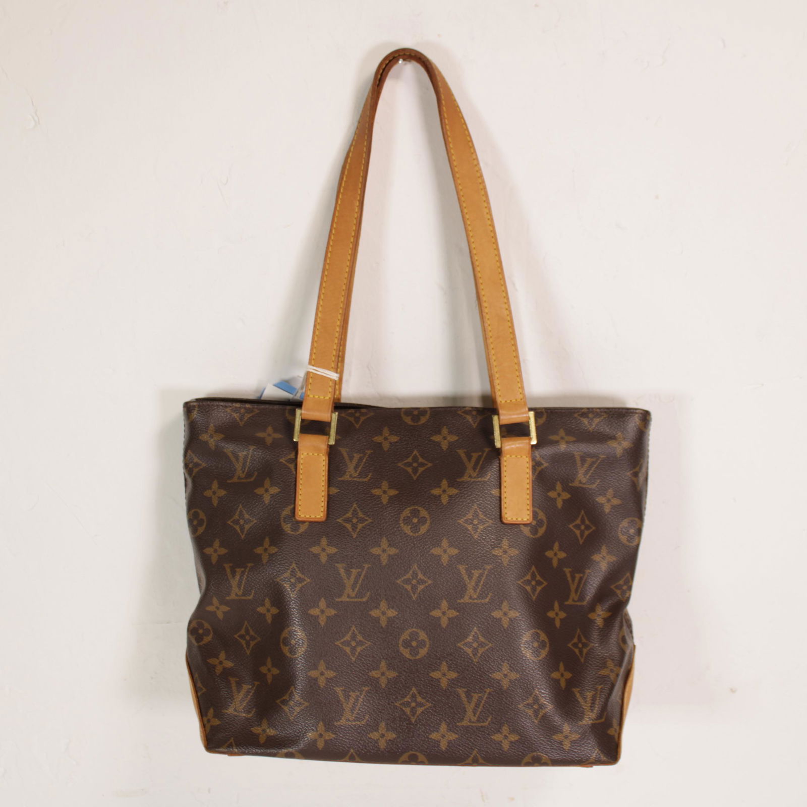 Louis Vuitton Cabas Piano in Monogram Canvas: Genuine Pre-Owned Louis Vuitton Cabas Piano in Brown Monogram Canvas in A condition. Date Code is DU1022. Measurements: 27*24*12cm (Length * Height * Width). This lot includes a certificate of authent