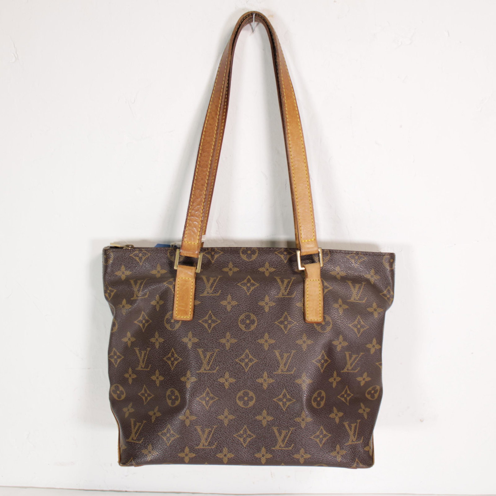 Louis Vuitton Cabas Piano in Monogram Canvas: Genuine Pre-Owned Louis Vuitton Cabas Piano in Brown Monogram Canvas in AB condition. Date Code is VI0092. Measurements: 27*24*12cm (Length * Height * Width). This lot includes a certificate of authen
