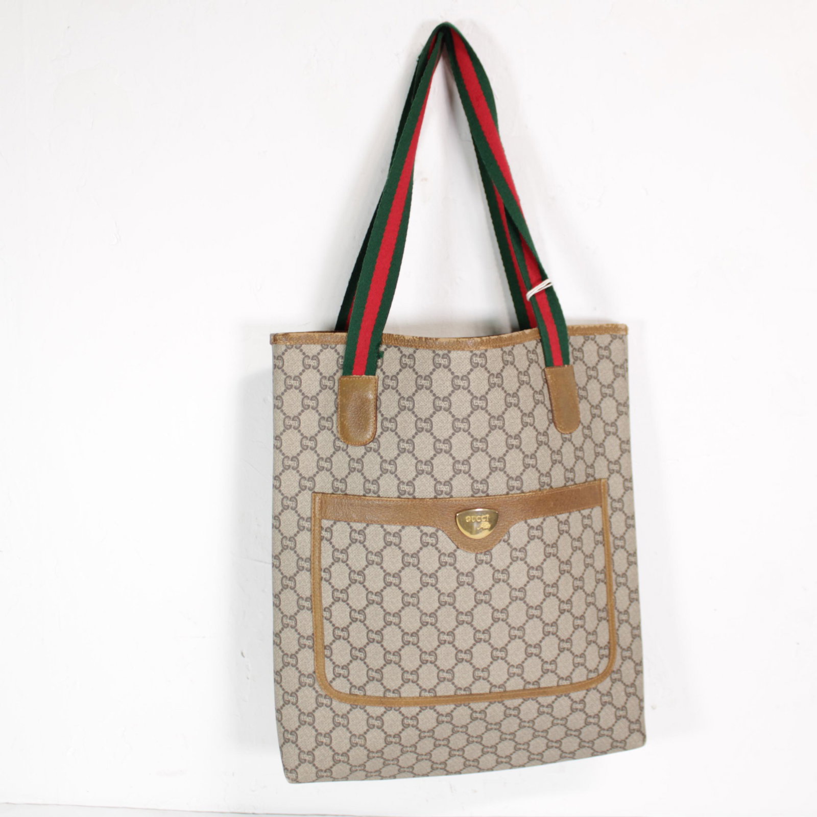 Gucci Vintage Gucci Plus Tote in Gucci Plus Coated: Genuine Pre-Owned Gucci Vintage Gucci Plus Tote in Brown Gucci Plus Coated Canvas in AB condition. Date Code is N/A This lot includes Pouch. Measurements: 34*40*6cm (Length * Height * Width). This lot