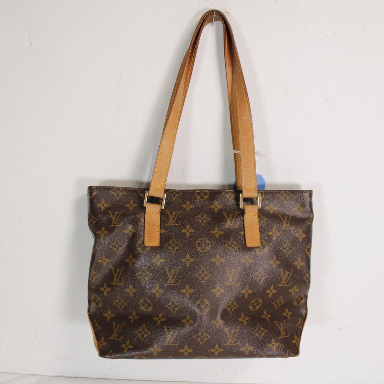 Louis Vuitton Cabas Piano in Monogram Canvas: Genuine Pre-Owned Louis Vuitton Cabas Piano in Brown Monogram Canvas in AB condition. Date Code is DU0072. Measurements: 27*24*12cm (Length * Height * Width). This lot includes a certificate of authen