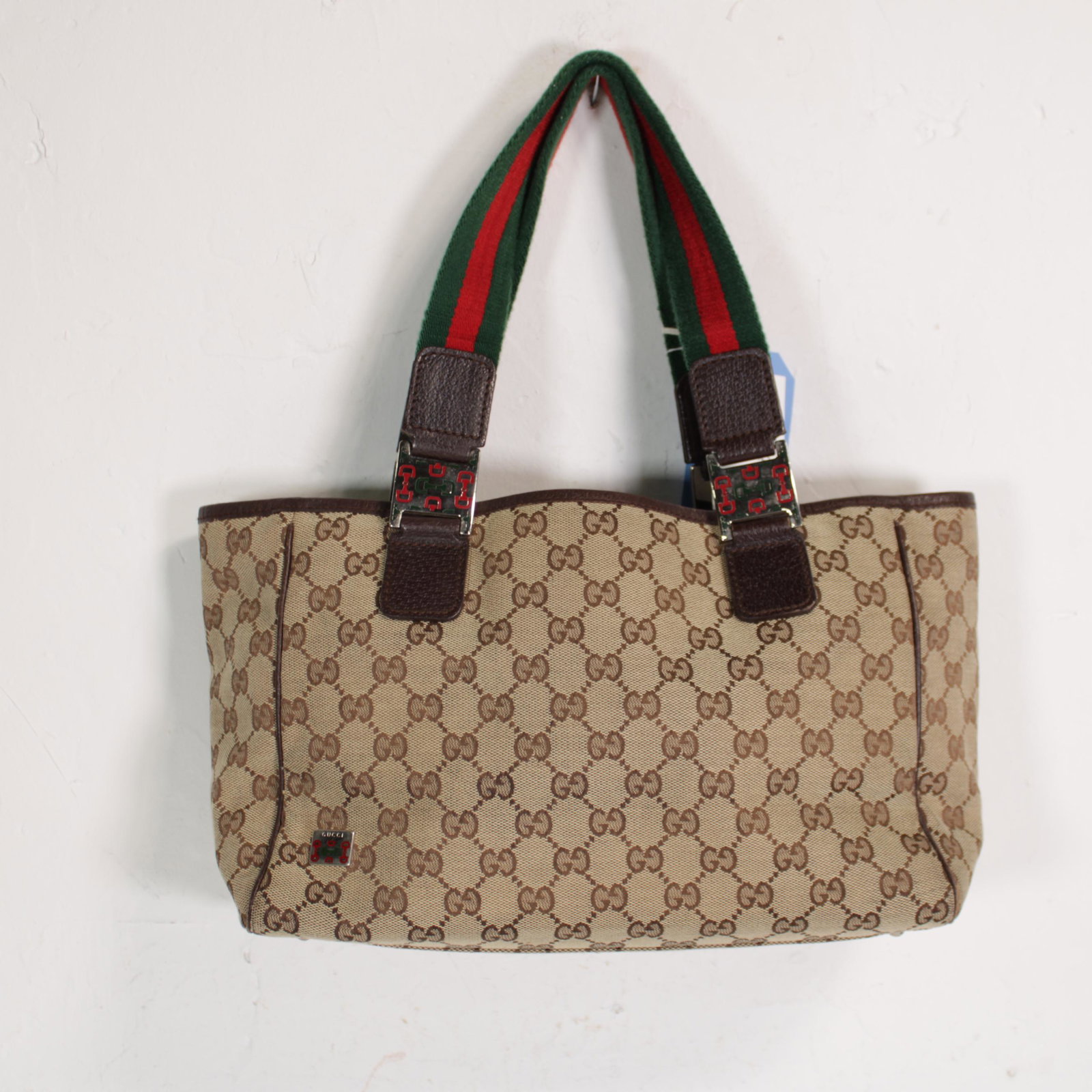 Gucci Rectangular Tote with Front Slip Pocket PM in: Genuine Pre-Owned Gucci Rectangular Tote with Front Slip Pocket PM in Beige/Dark Brown Monogrammed Canvas in AB condition. Date Code is 145810-002122. Measurements: 30*20*11cm (Length * Height * Width