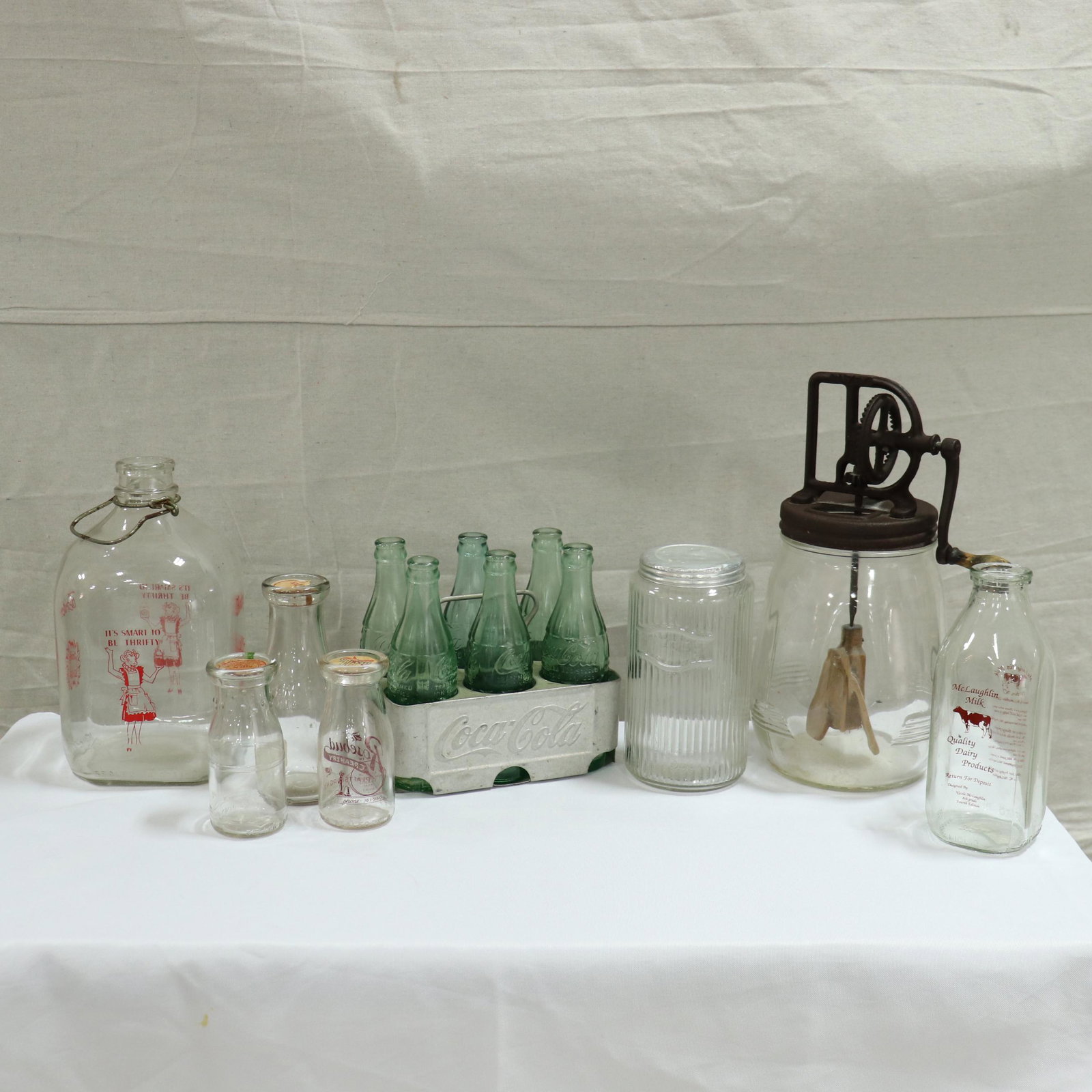 Collection of Milk Jugs, Coke Bottles, Churn Etc.: Collection of Milk Jugs, Coke Bottles, Churn Etc. - Churn is