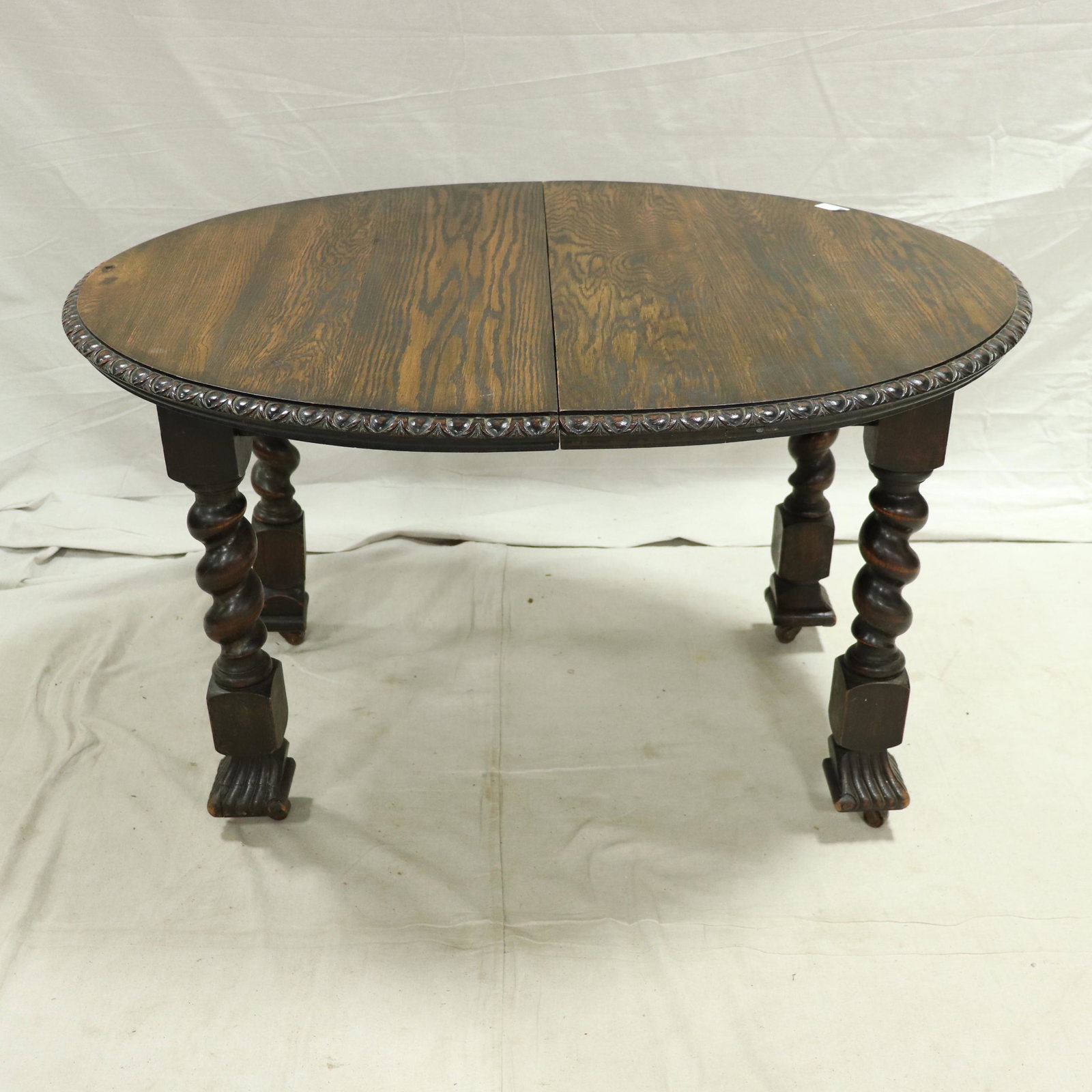 Oval Carved Barley Twist Crank Table with Paw Feet: Oval Carved Barley Twist Table with Paw Feet - 30 in tall x 51 x 42 - One 20 in leaf.