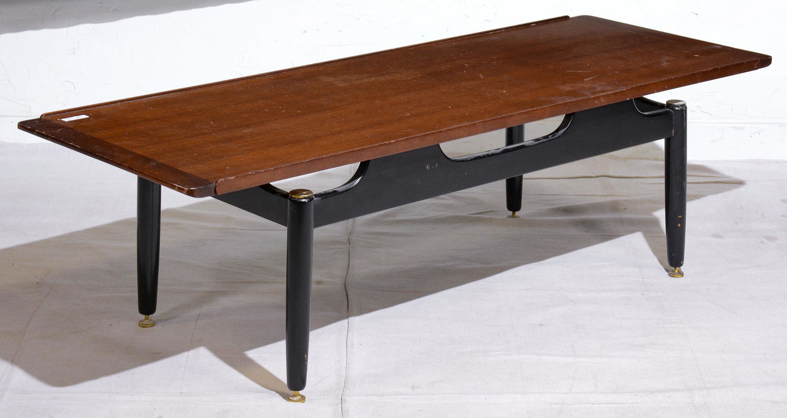 Black Tola Coffee Table by G-Plan: This Danish modern style coffee table is British made by mid century modern furniture maker G Plan - part of their Black and Tola range. All 4 brass caps are present and it has all 4 adjustable feet -