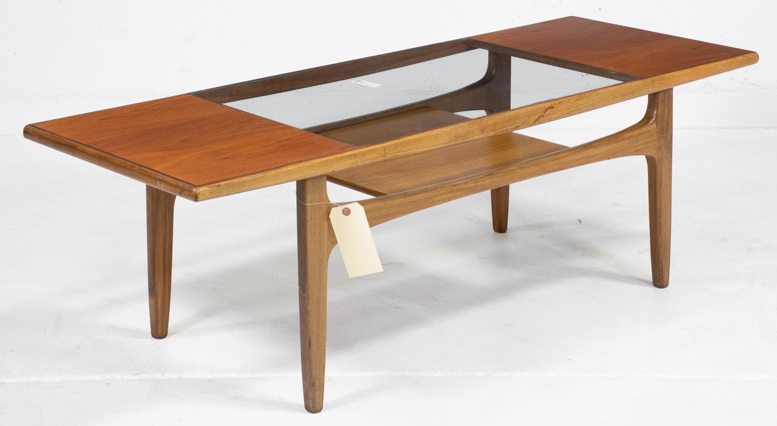 G-Plan Fresco Coffee Table as seen in Mad Men: This Danish Modern Style teak coffee table is British and made by British Mid Century Modern Furniture Maker G Plan (gplan). This model table was featured in the Mid Century Modern office of Don Drape