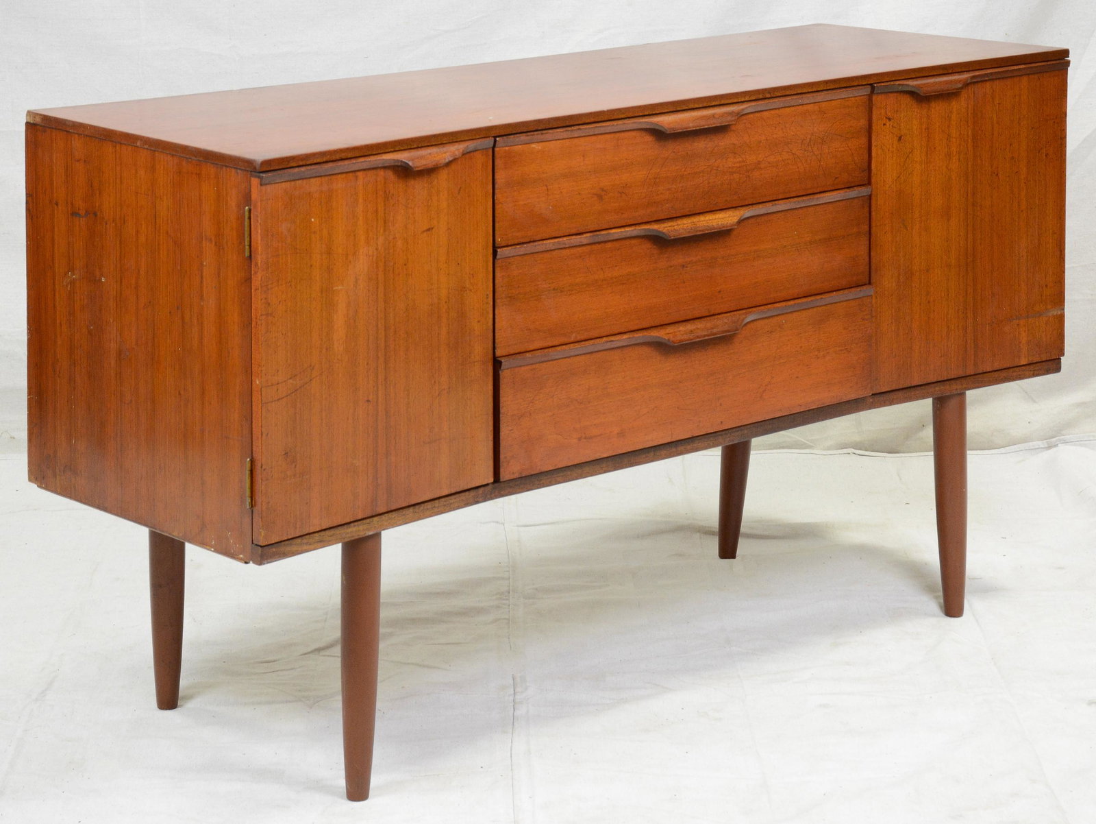 Mid Century Modern Folded Handle Sideboard: This Danish Modern Style Teak Credenza is made by British Mid Century Modern Furniture Maker Austinsuite - 30 in tall x 52 in x 18