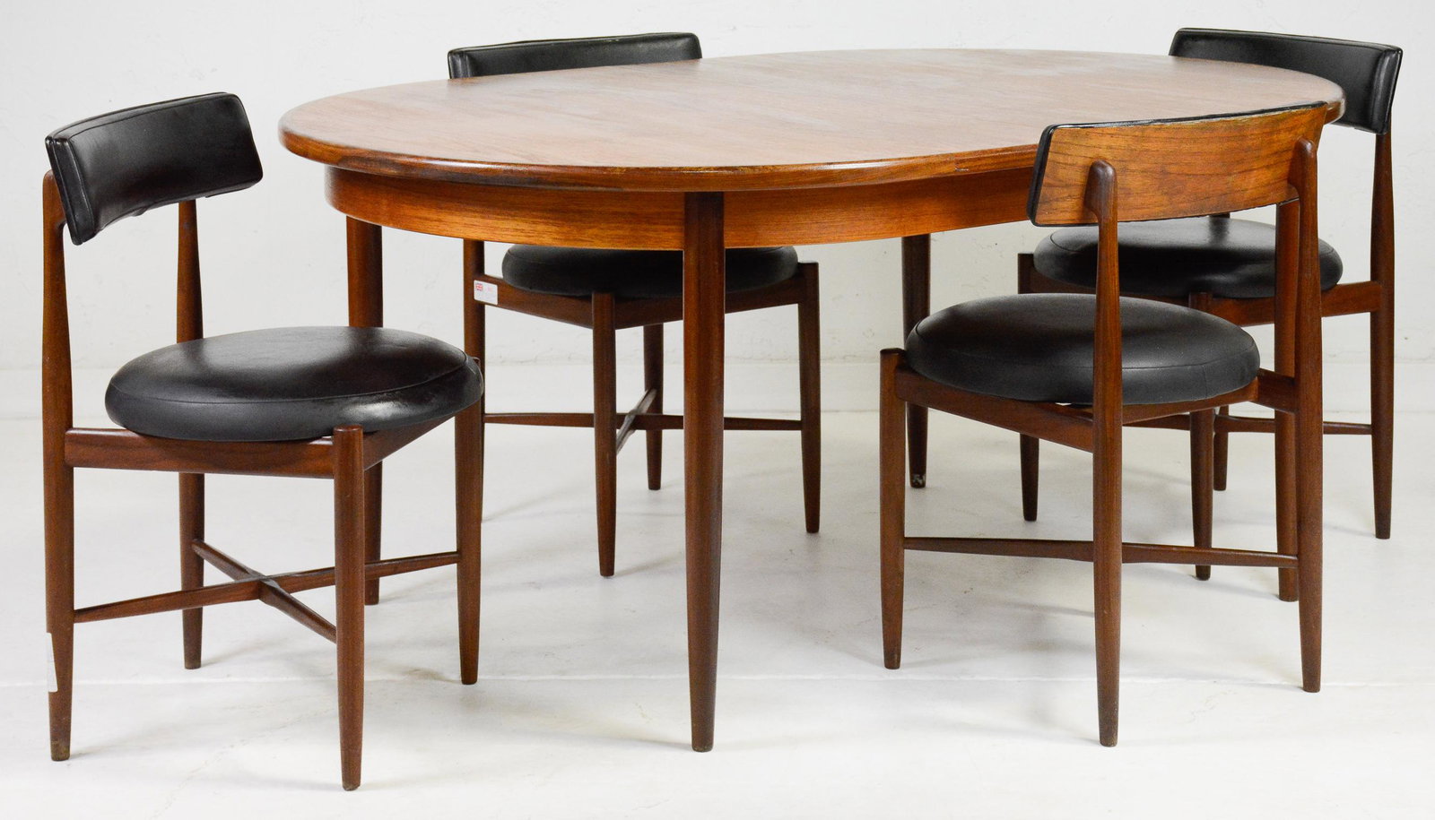 Oval Mid Century Teak Table By Gplan & 4 Chairs: Danish Modern Style Teak Dining Table includes a pop-out butterfly style leaf & is made by Mid Century Modern Furniture Maker G Plan & 4 Chairs - 29 in tall x 65 x 45, leaf is 18 in wide and the chair