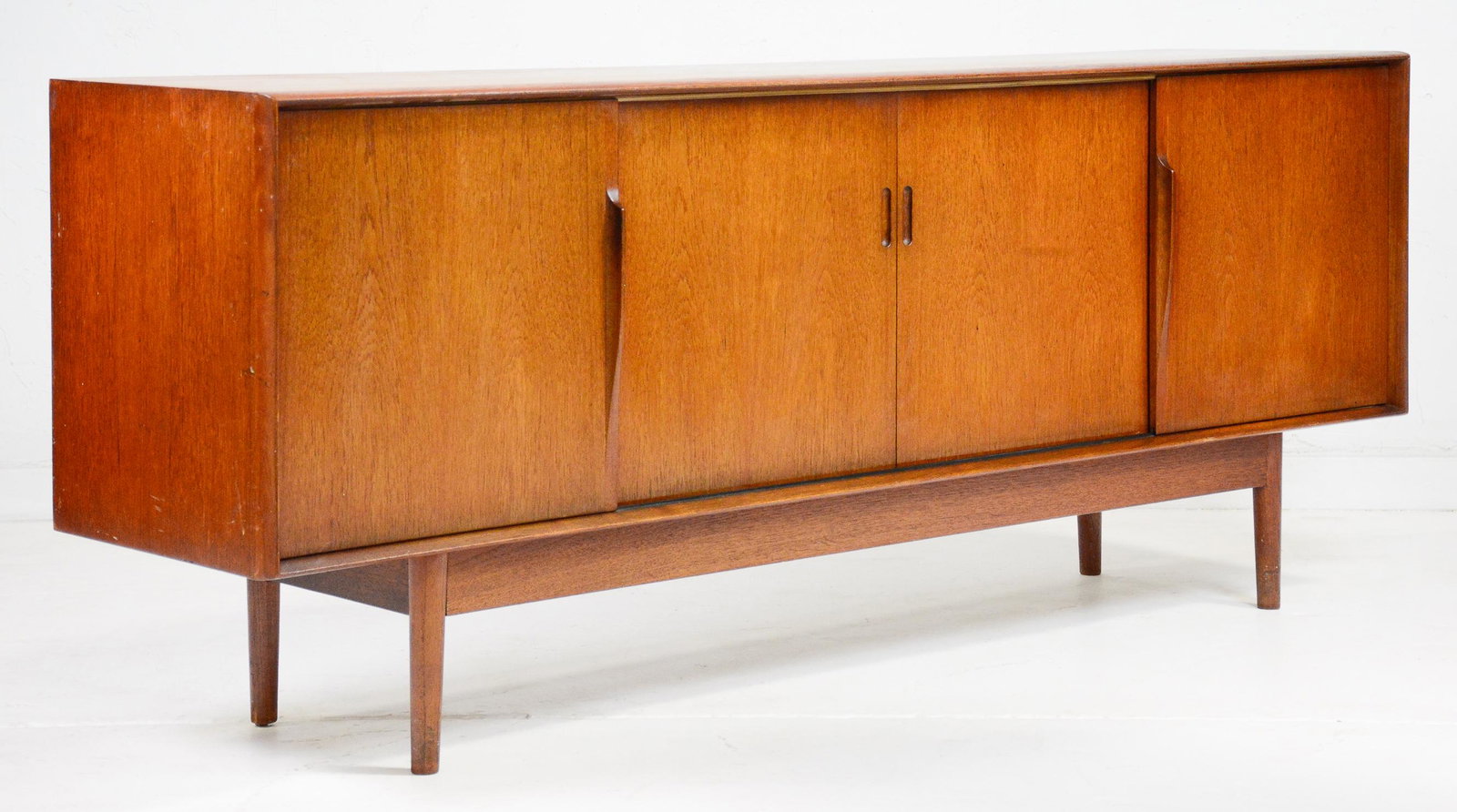 Mid Century Modern Teak Sideboard With 4 Sliding Doors: Teak mid century modern credenza with 4 Sliding Doors likely Danish in Origin - 31 in tall x 78 x 18