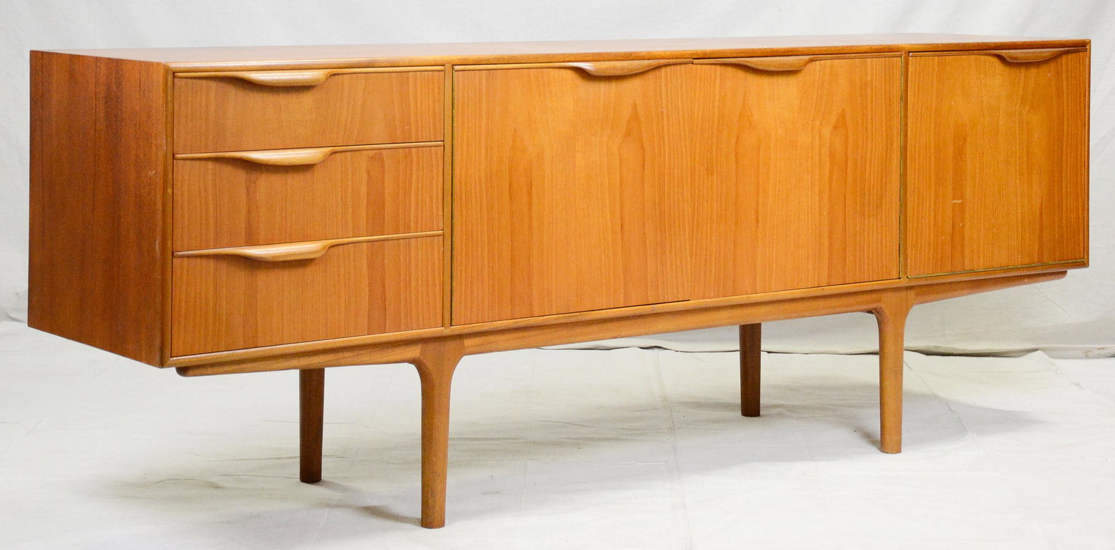 Mid Century Modern Sideboard by McIntosh - "Dunvegan": This Danish Modern Style Teak Credenza / Cocktail Sideboard with folded handles & pull out tray is made by Scottish Mid Century Modern Furniture Maker McIntosh. It was designed by Tom Robertson, it is