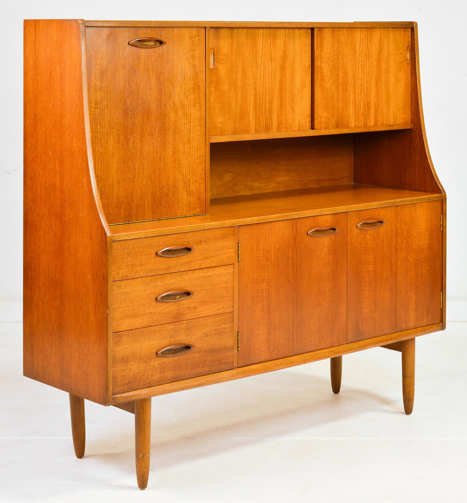 Mid Century Teak Cocktail Cabinet with Drop Down: This Danish Modern Style Teak High board / Cocktail Cabinet is British & is very likely made by Mid Century Modern Furniture Maker Jentique. 50 in tall x 54 x 16