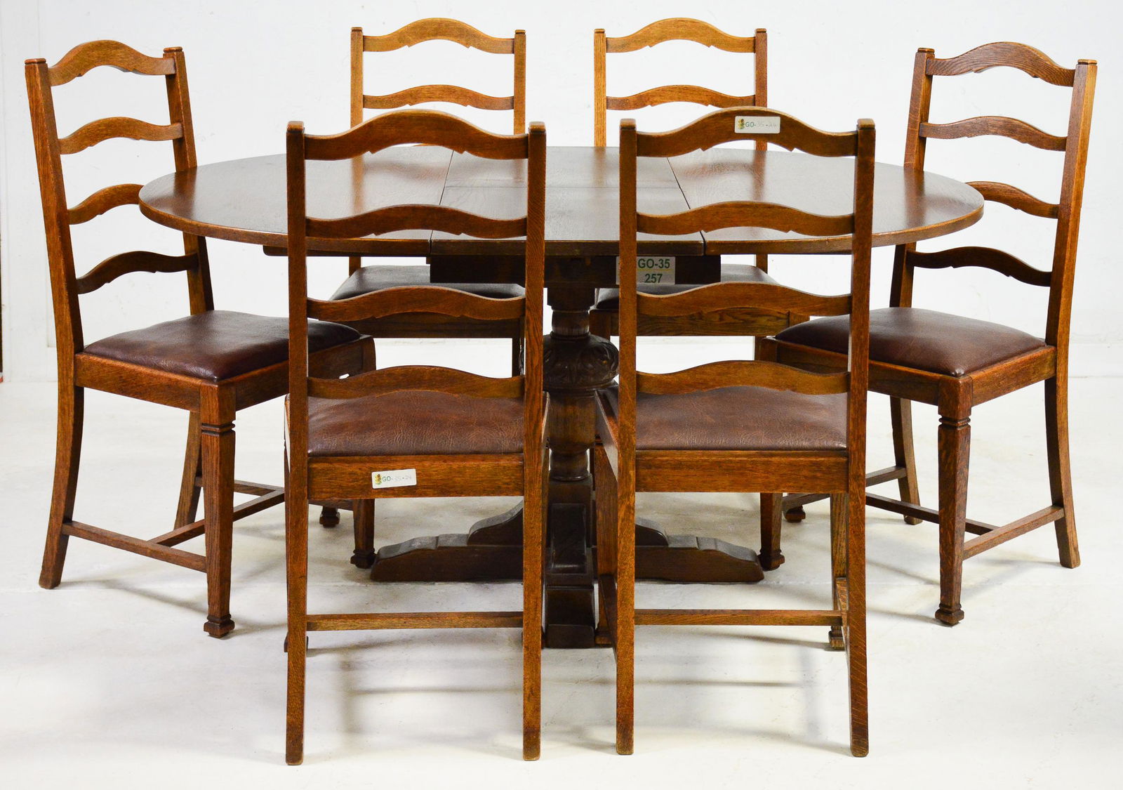 English Oak Drop Leaf Table & 6 Chairs: English Oak Drop Leaf Table & 6 Chairs - Table is 31 in tall x 62 x 45, Chairs are 39 in tall x 18 x 17