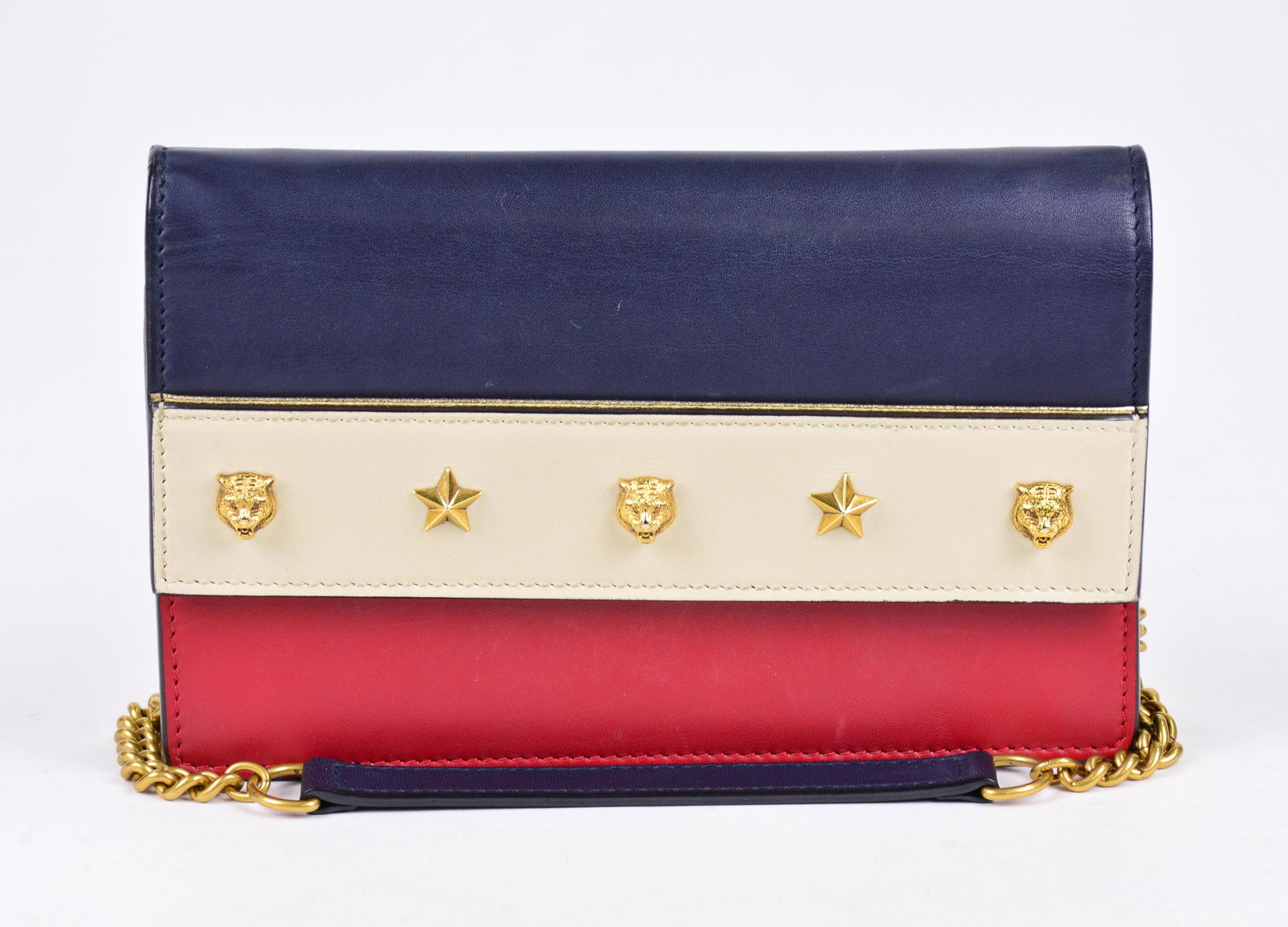 Gucci Tiger Studded Wallet on Chain in Leather: Genuine Pre-Owned Gucci Tiger Studded Wallet on Chain in Navy Blue/Ivory/Dark Red Smooth Leather in A condition. Date Code is 421843-0416. Measurements: 20*13,5*2,5cm (Length * Height * Width). This l