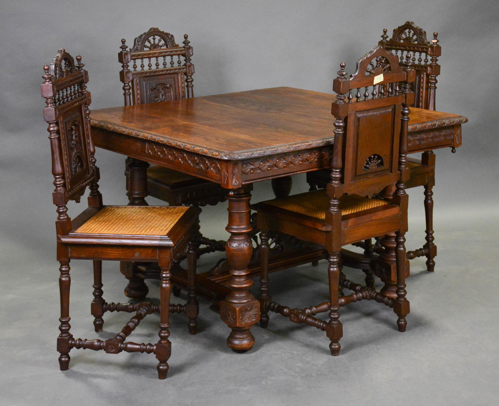 Breton Style Carved Table & 4 Cained Seat Chairs: Breton Style Carved Table & 4 Cained Seat Chairs in Chestnut - Table is 30 in tall x 46 x 45, Chairs are 41 in tall x 18 x 18