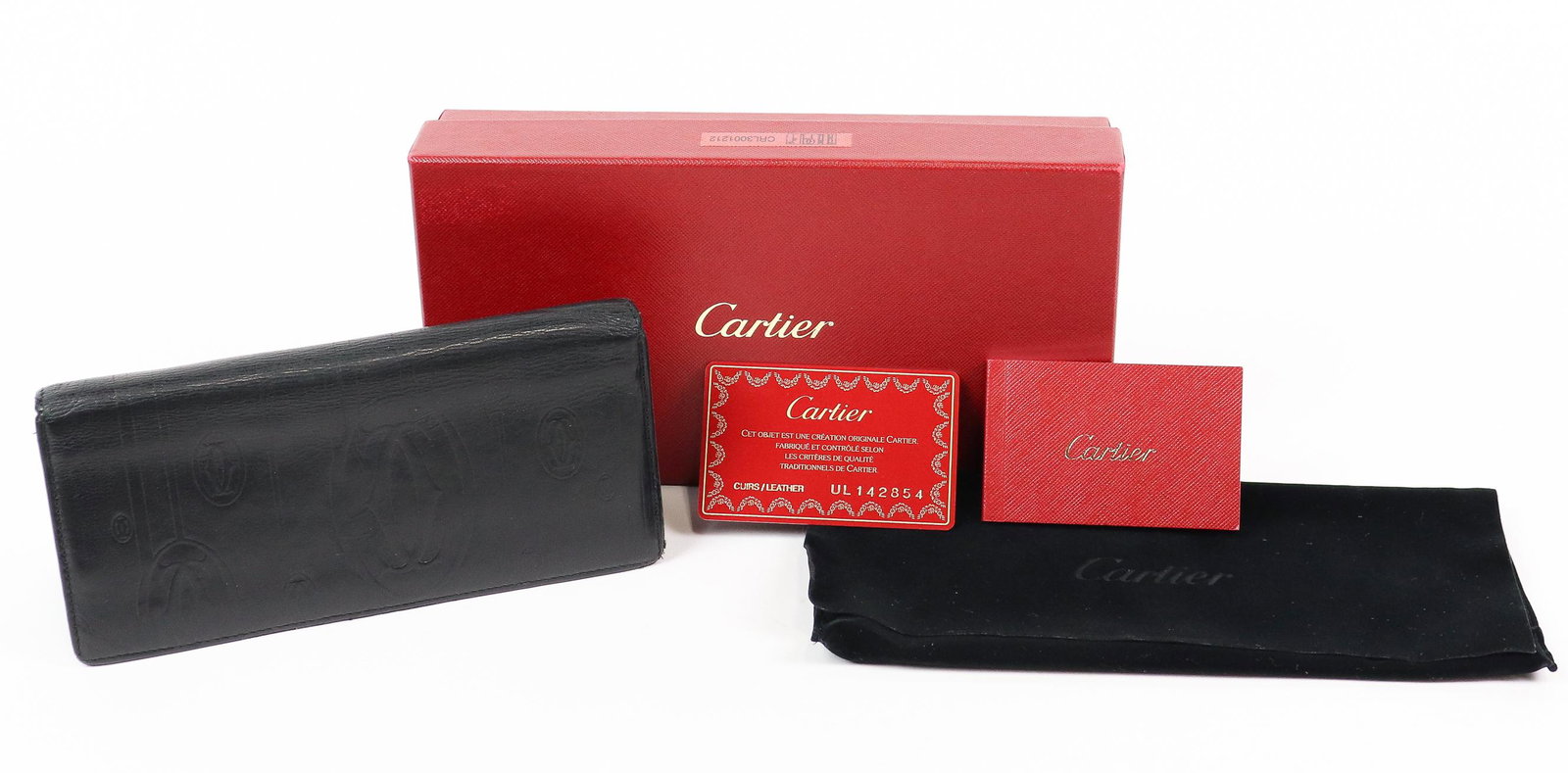 Cartier Pasha Matrix International Wallet: Genuine Pre-Owned Cartier Pasha Matrix International Zipped Wallet in Black Logo Embossed Leather in AB condition. Date Code is UL142854 This lot includes Dustbag, Box, Authenticity Card, Booklet. Mea