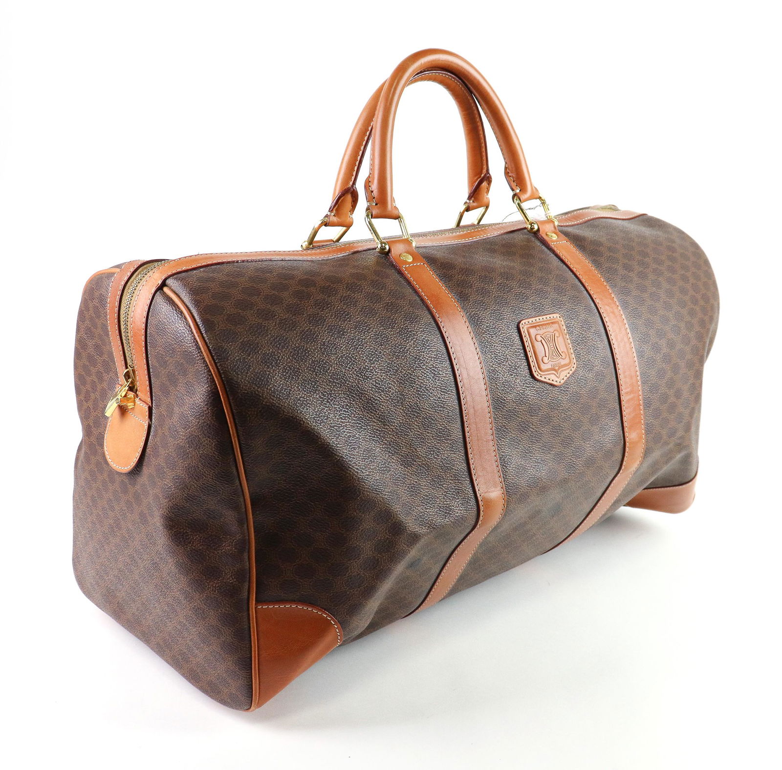 Celine Vintage Boston Travel Bag in Burnt Orange: Genuine Pre-Owned Celine Vintage Boston Travel Bag in Brown/Burtn Orange Macadam Coated Canvas in AB condition. Date Code is N/A Measurements: 49*28*24 (Length * Height * Width). This lot includes a c
