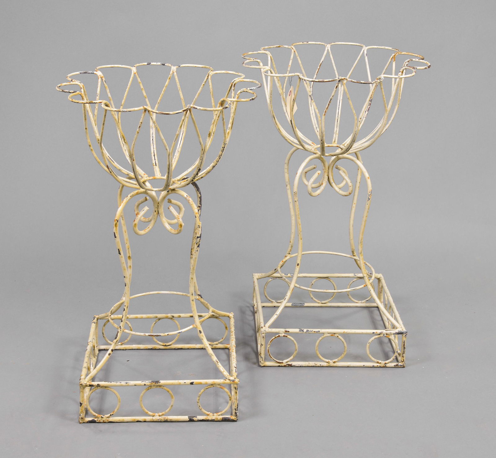 Pair of low shaped painted iron planters (1 of 3)