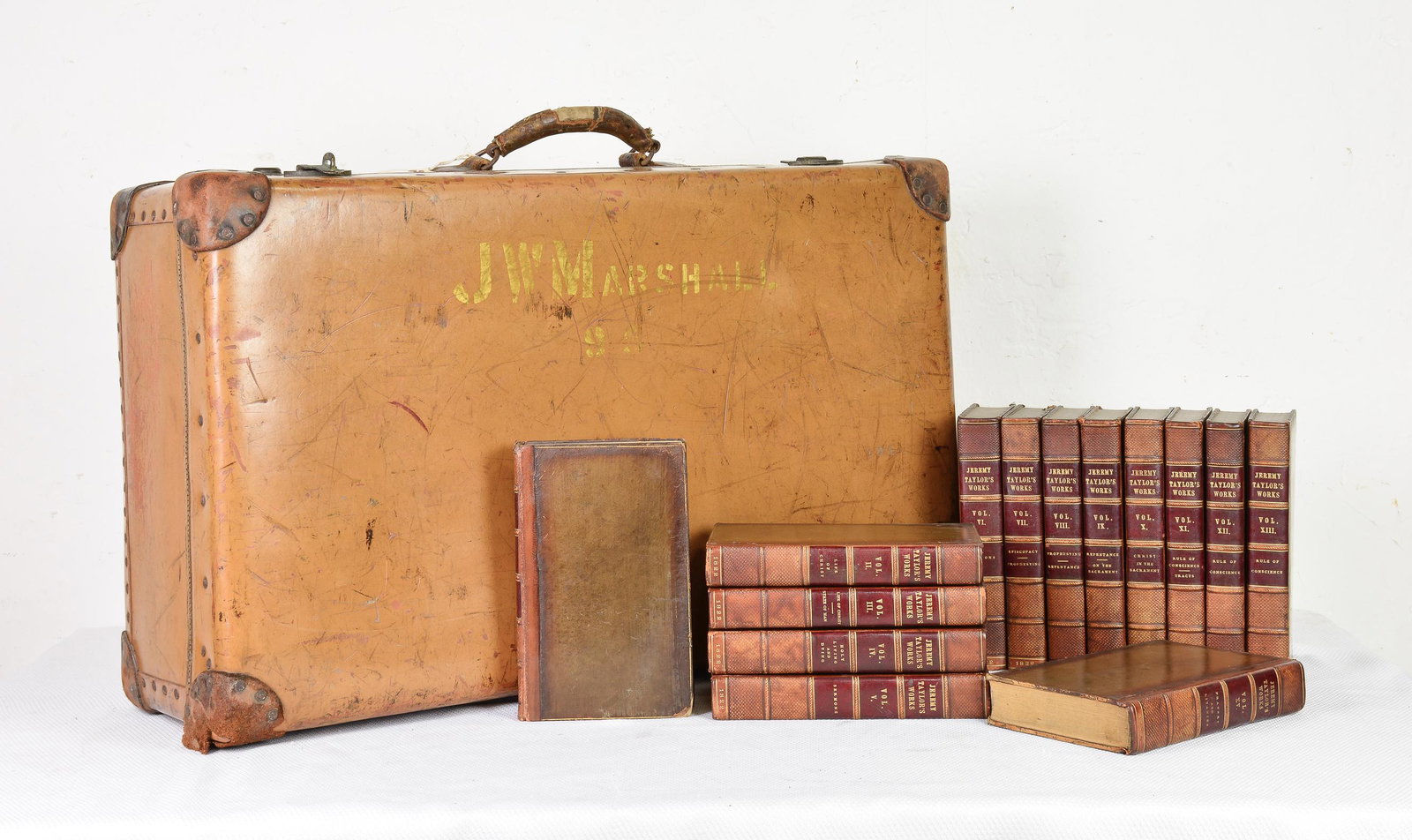Leather Suitcase and 14 Leather Books: Suitcase 17 in tall x 29 x 10 Circa 1822 Books 9 in tall x 6 x 2