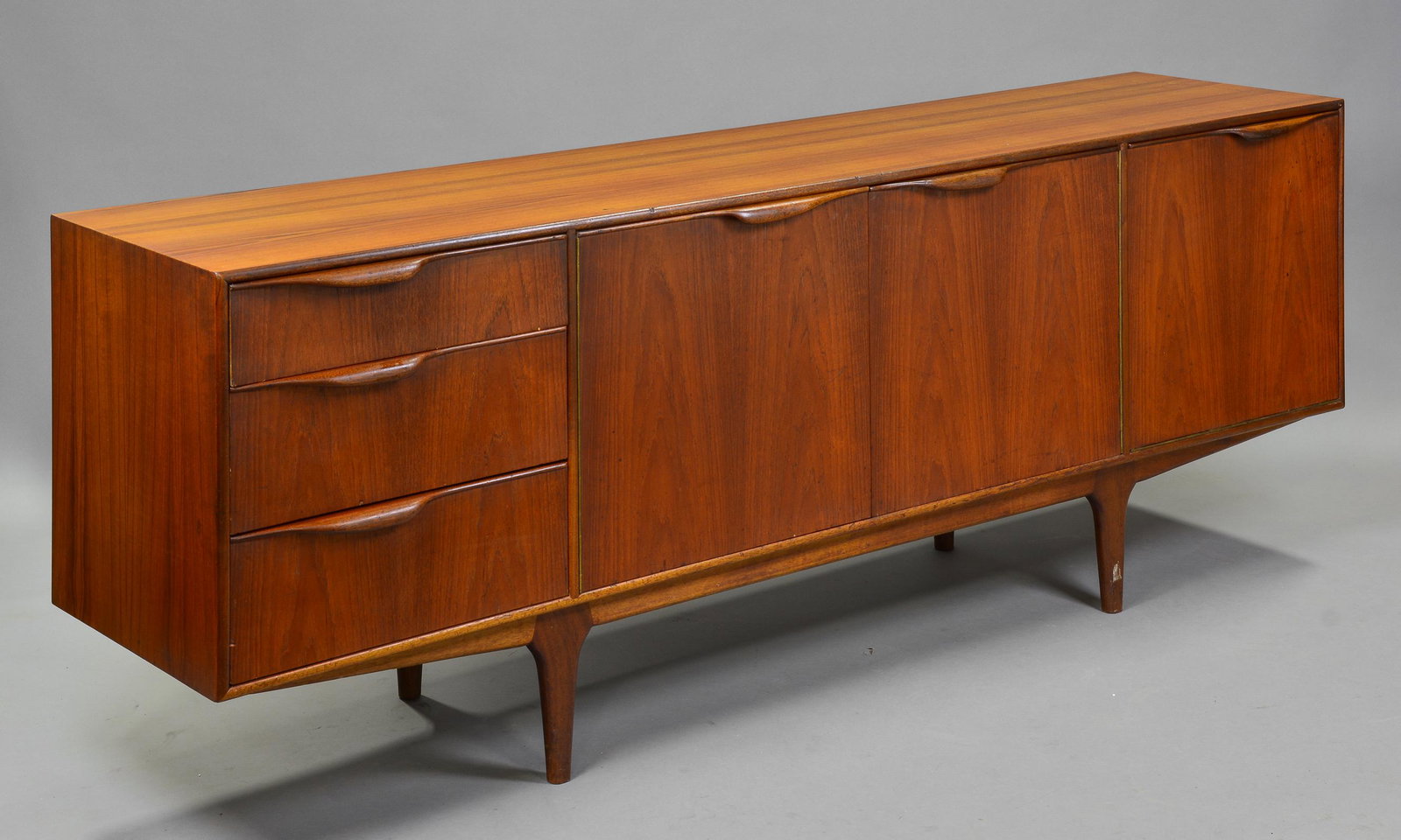 Mid Century Modern Sideboard - Dunvegan: This Danish Modern Style Teak Credenza / Cocktail Sideboard with folded handles & pull out tray is made by Scottish Mid Century Modern Furniture Maker McIntosh. It was designed by Tom Robertson, it is