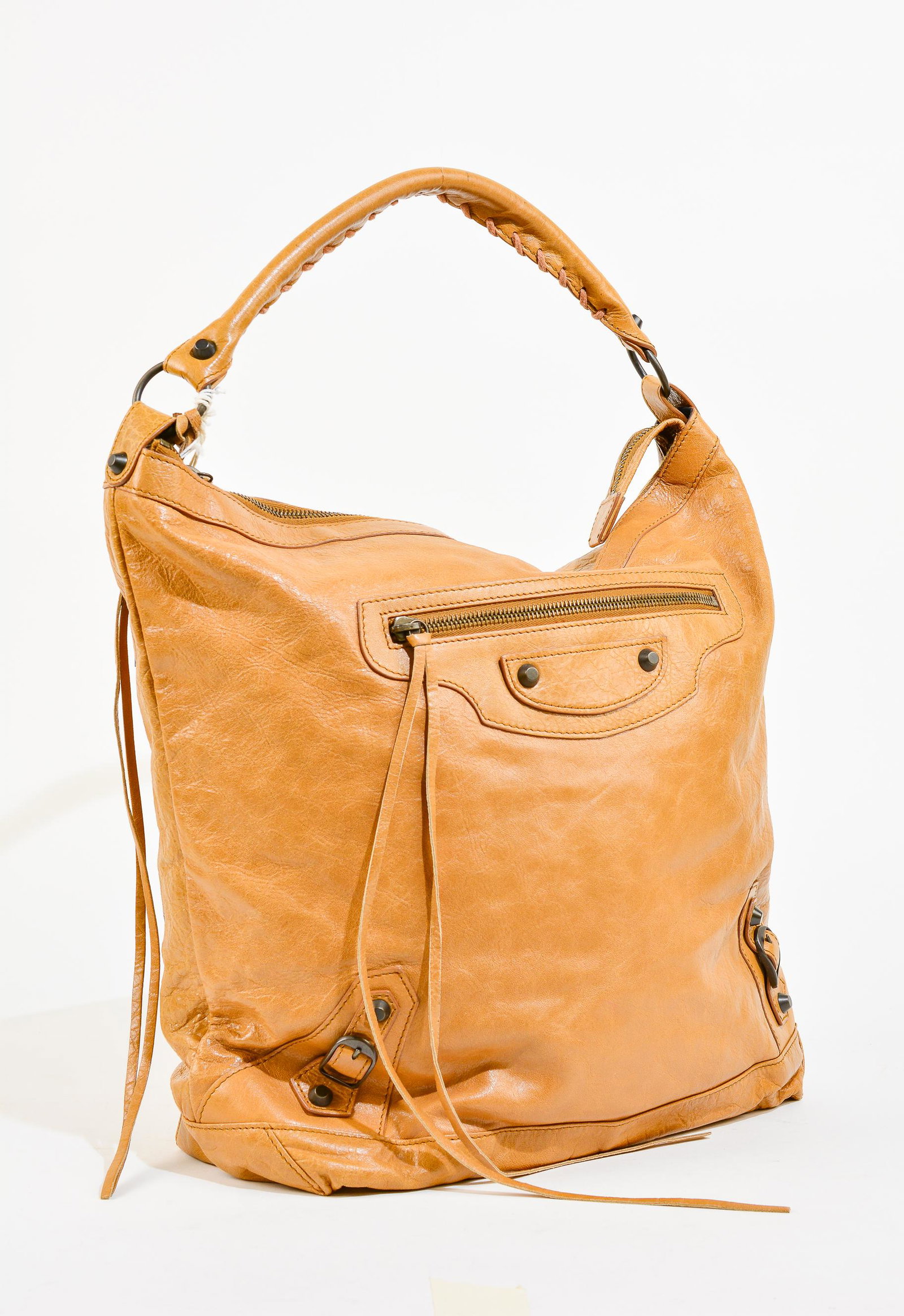 Balenciaga Classic Day - Tan Leather Distressed Leather: Genuine Pre-Owned Balenciaga Classic Day in Tan Distressed Leather in A condition. Date Code is 140442.2360-K.538735 This lot includes the following accessories: Dustbag, Mirror. Measurements: 39*31*1