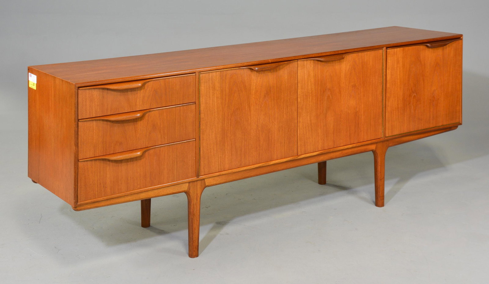Mid Century Sideboard - Mcintosh - "Dunvegan": This Danish Modern Style Teak Credenza / Cocktail Sideboard with folded handles & pull out tray is made by Scottish Mid Century Modern Furniture Maker McIntosh. It was designed by Tom Robertson, it is