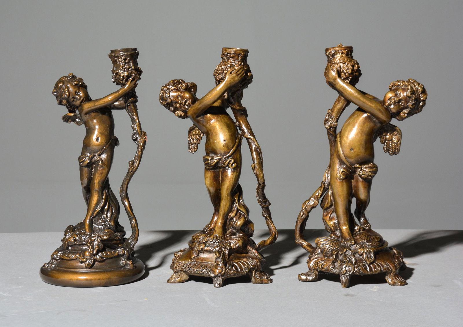 2 Bronze Cherub Candlesticks & 1 Other (1 of 5)