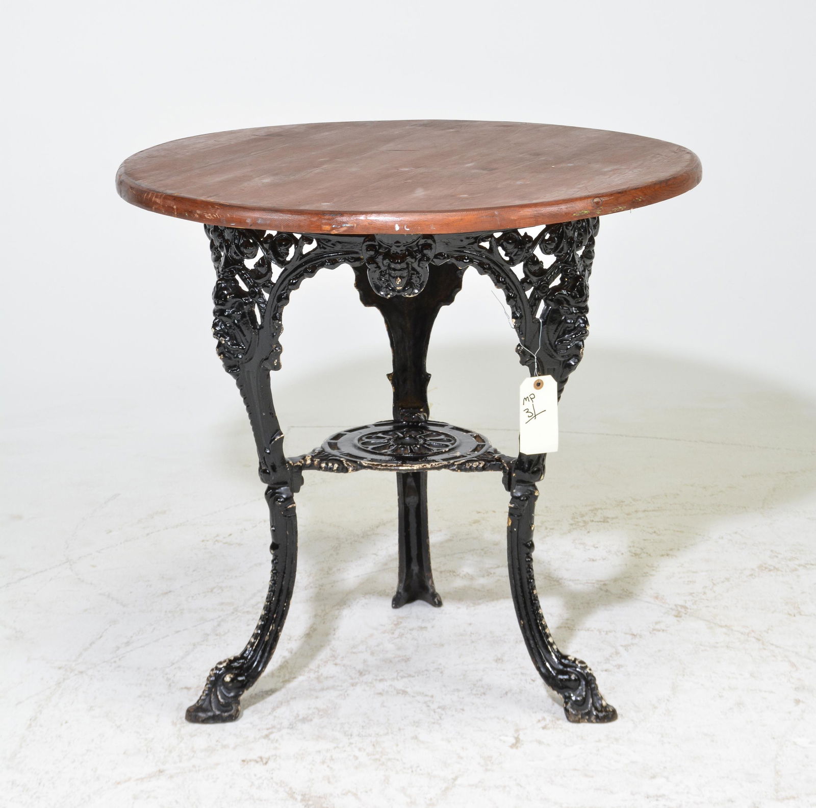 Brown Pub Table With Cast Metal Base (1 of 4)