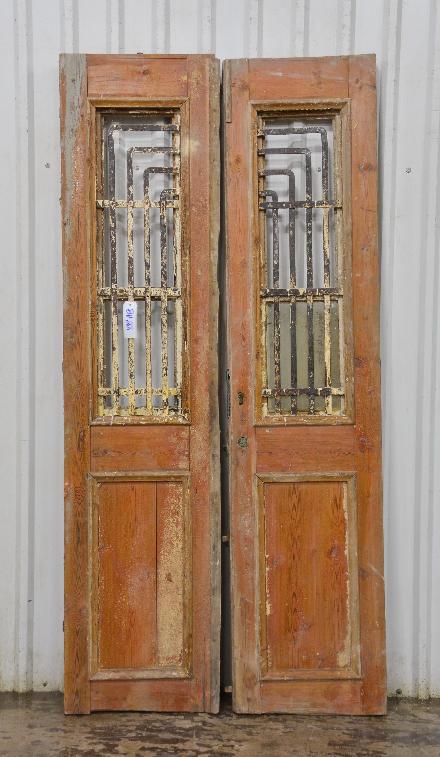 Brown Door With Metal Panels (1 of 2)