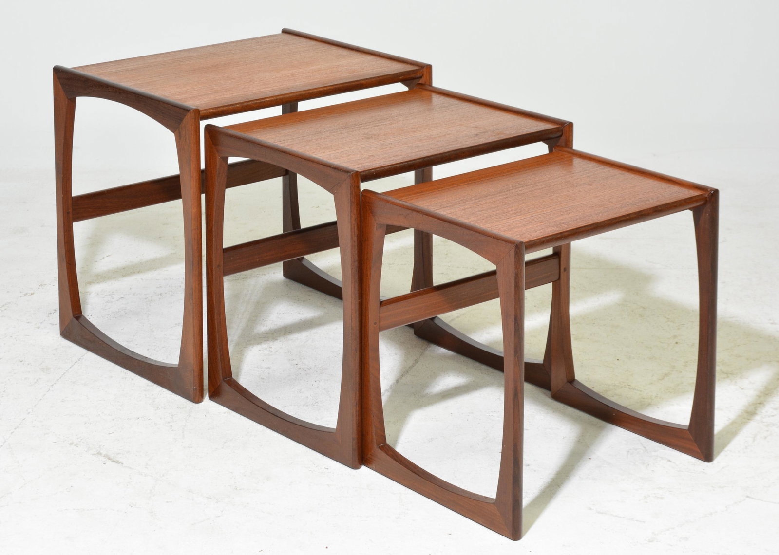Mid Century Modern Quadrille Nest of 3 Tables: This Danish Modern Style Nest is British and made by Mid Century Modern Furniture Maker G Plan ( Gplan ) it stacks to make a bookcase as well. Measurement for largest table is 20 in tall x 21 x 17
