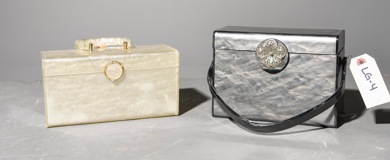 2 1950's Pearlized Lucite Purses / Hand Bags: 2 1950's Pearlized Lucite Purses / Hand Bags - One has a silver filigree flower on the clip