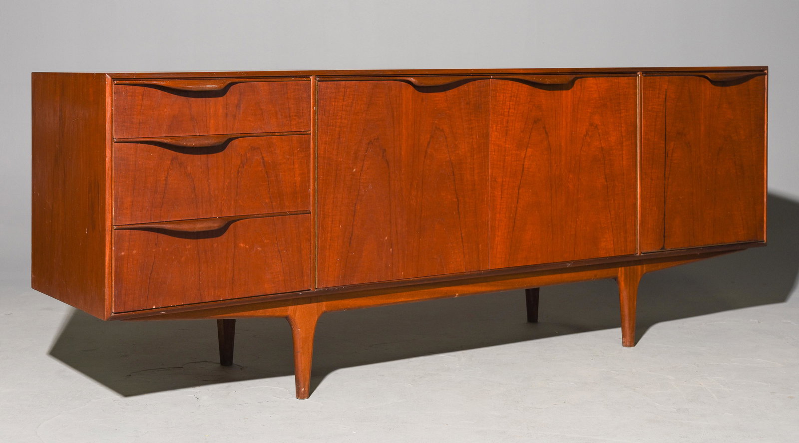 Mid Century Sideboard - Mcintosh - "Dunvegan": This Danish Modern Style Teak Credenza / Cocktail Sideboard with folded handles & pull out tray is made by Scottish Mid Century Modern Furniture Maker McIntosh. It was designed by Tom Robertson, it is