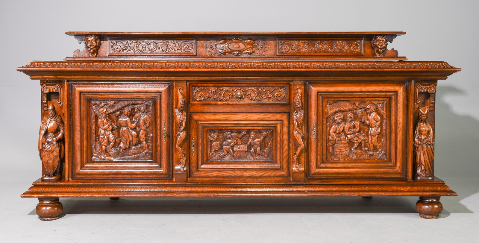 Belgian Carved Oak Sideboard with Figural Relief: Belgian Carved Oak Sideboard with Figural Relief - Surface height is 36.5 inches